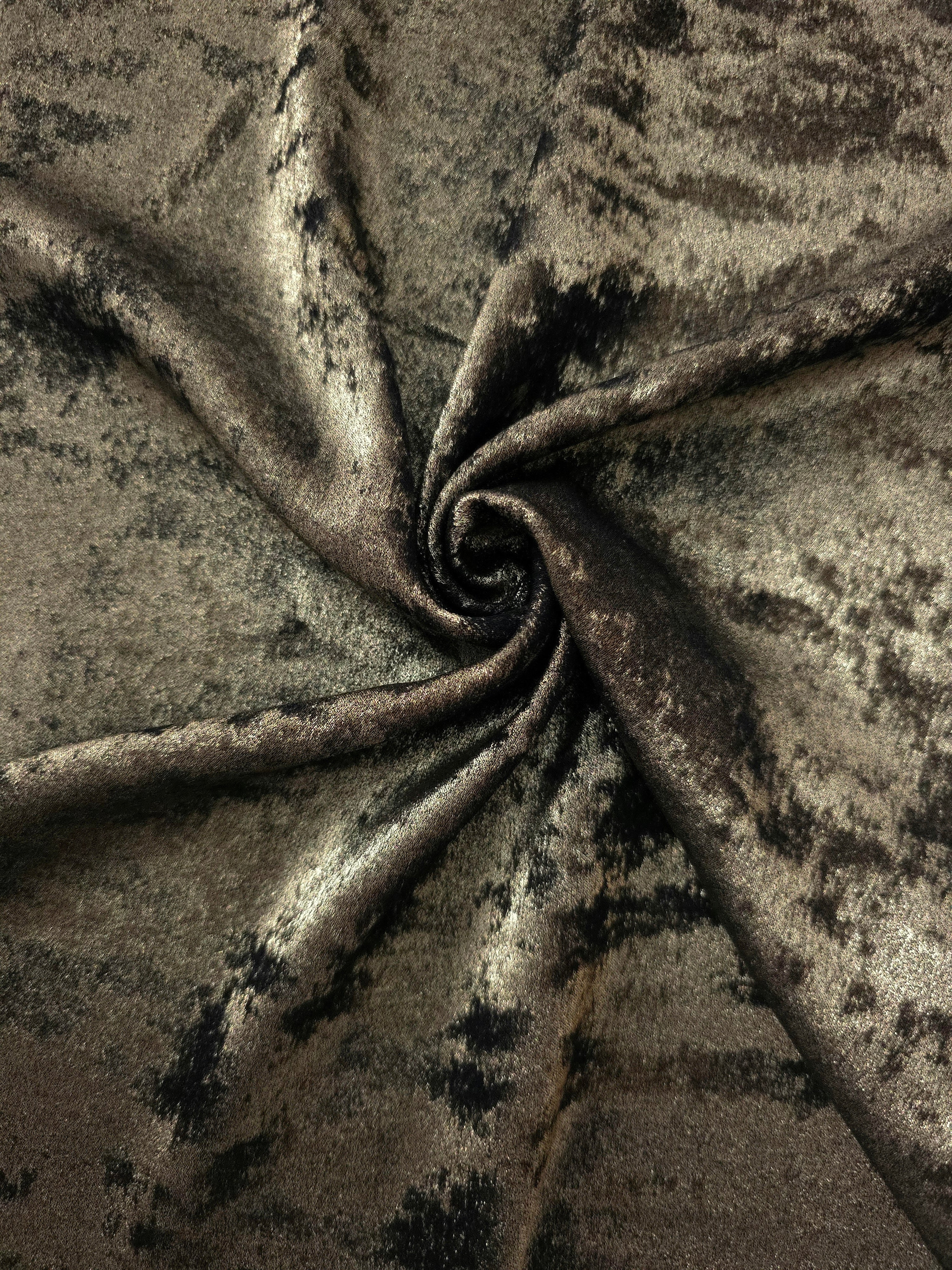 Rosette drape of Antique Olive Lurex Italiano fabric emphasizing shimmer for kaftans and occasionwear.