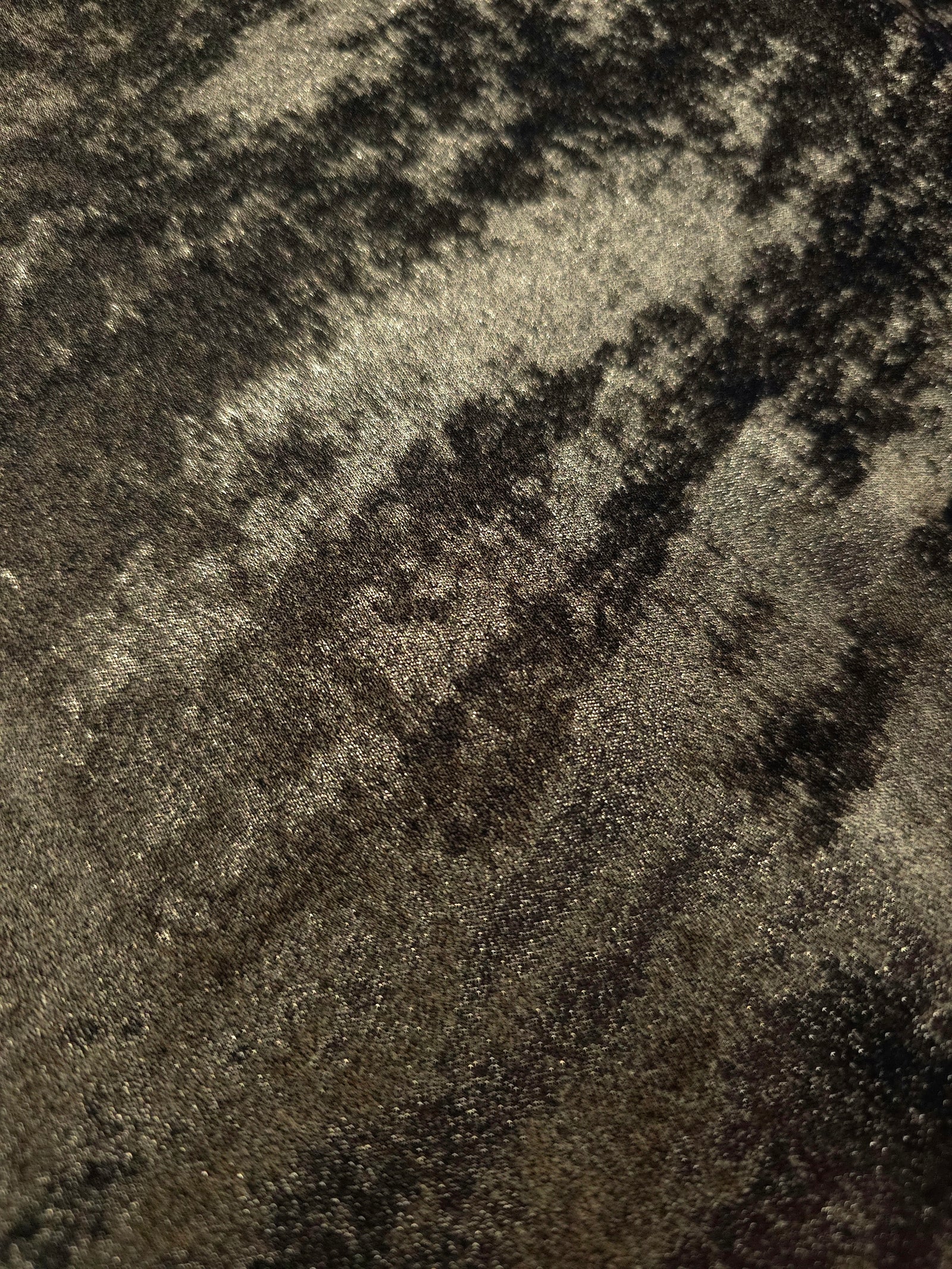 Macro close-up of Antique Olive Lurex Italiano fabric revealing metallic texture for designer apparel.