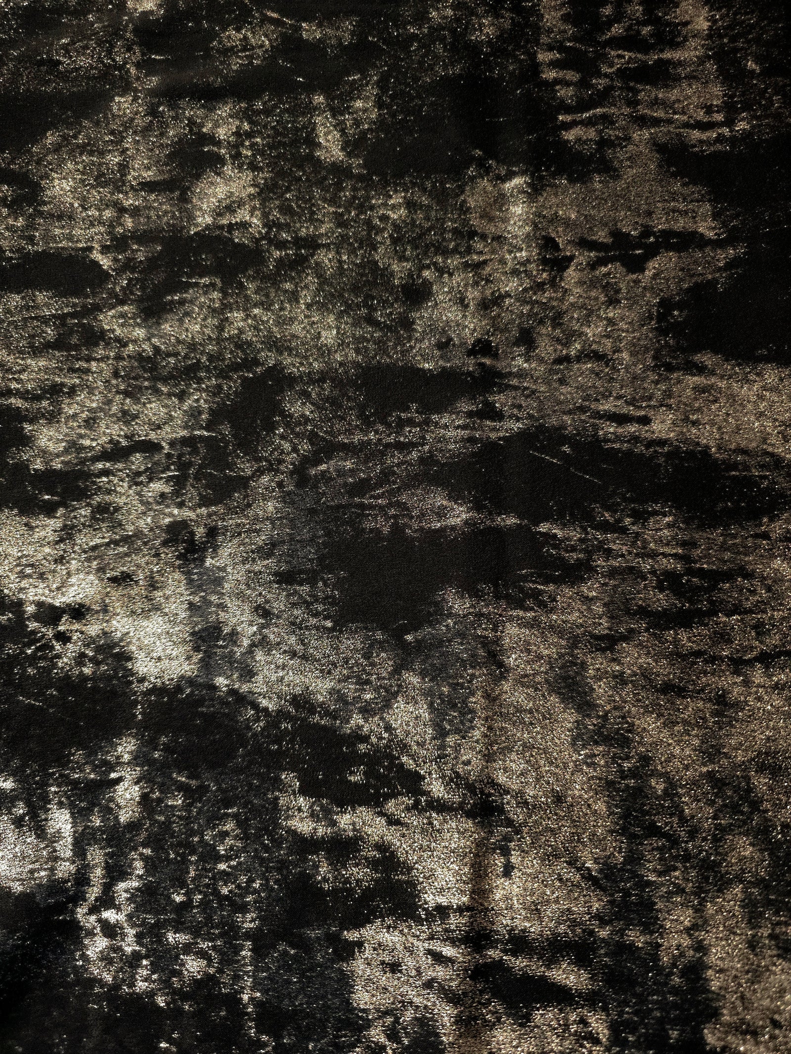 Flat view of Black Bronze Lurex Italiano fabric showing its metallic foil surface for luxury apparel.