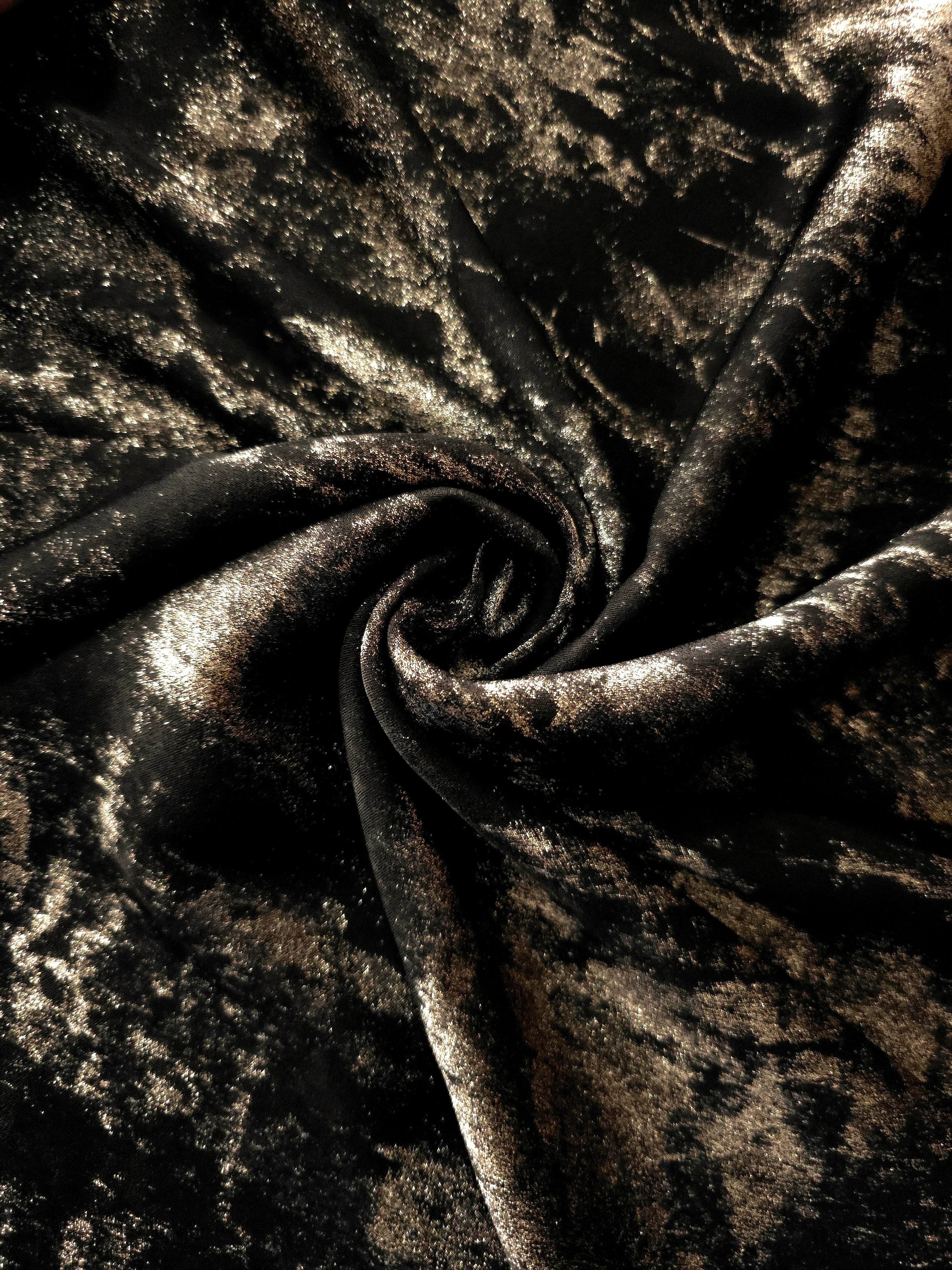 Rosette drape of Black Bronze Lurex Italiano fabric emphasizing shimmer for kaftans and occasionwear.