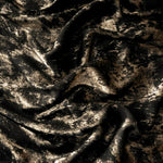 Reverse side of Black Bronze Lurex Italiano fabric showing the backing and metallic finish for garment production.