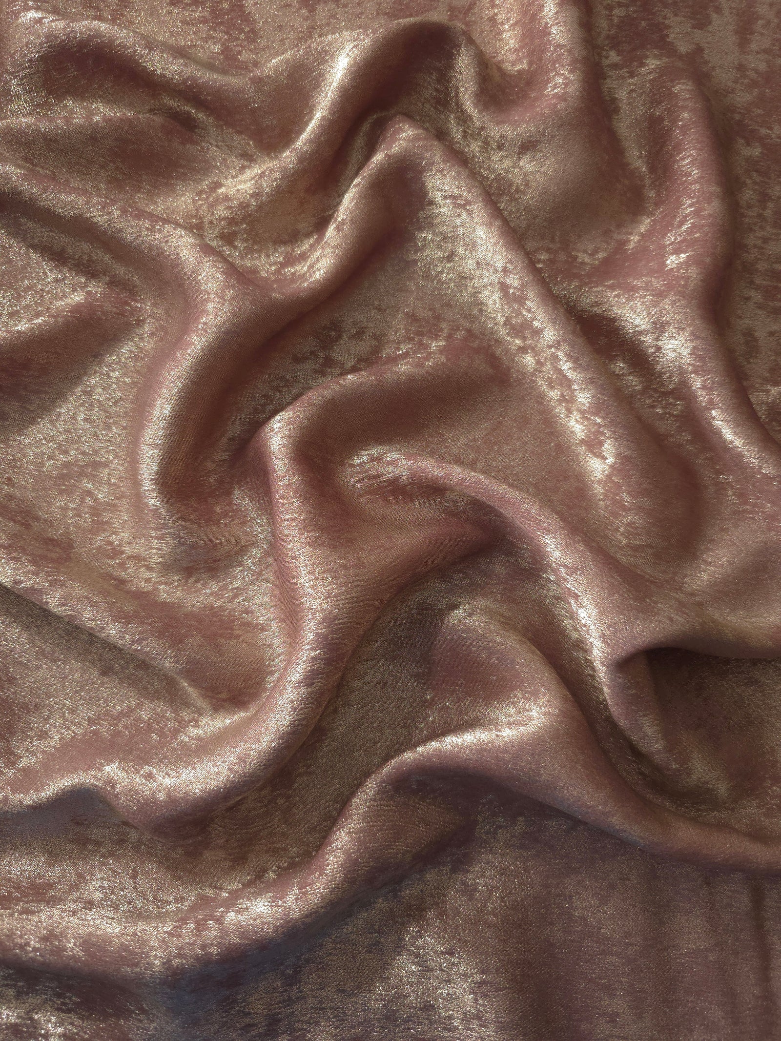 Flowing folds of Blush Taupe Lurex Italiano fabric highlighting drape for abayas, kaftans and dresses.
