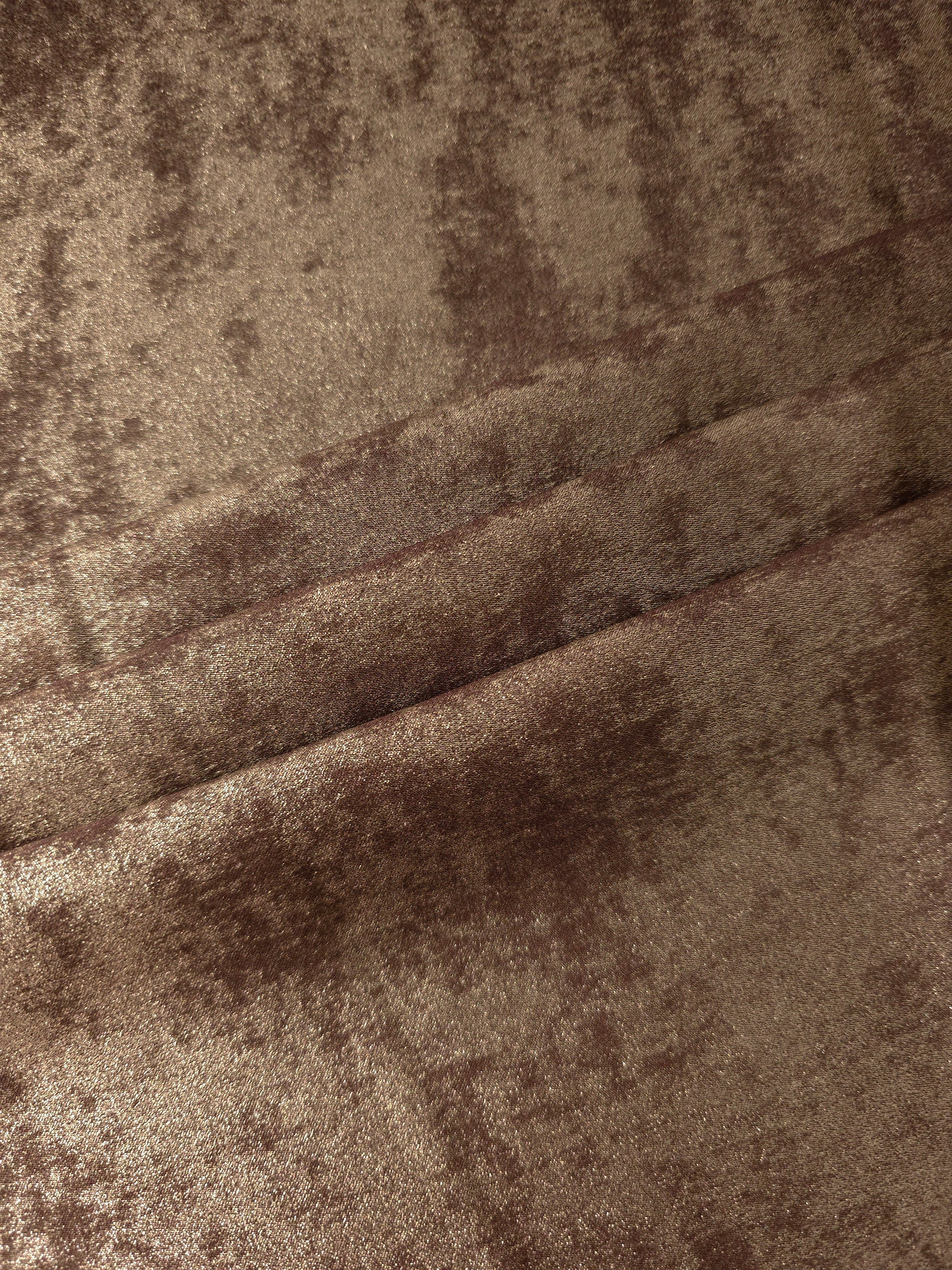 Bronze Taupe Lurex Italiano fabric in diagonal folds showing metallic sheen and drape for eveningwear.