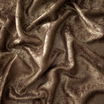 Flowing folds of Bronze Taupe Lurex Italiano fabric highlighting drape for abayas, kaftans and dresses.