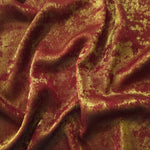 Flowing folds of Burgundy Gold Lurex Italiano fabric highlighting drape for abayas, kaftans and dresses.