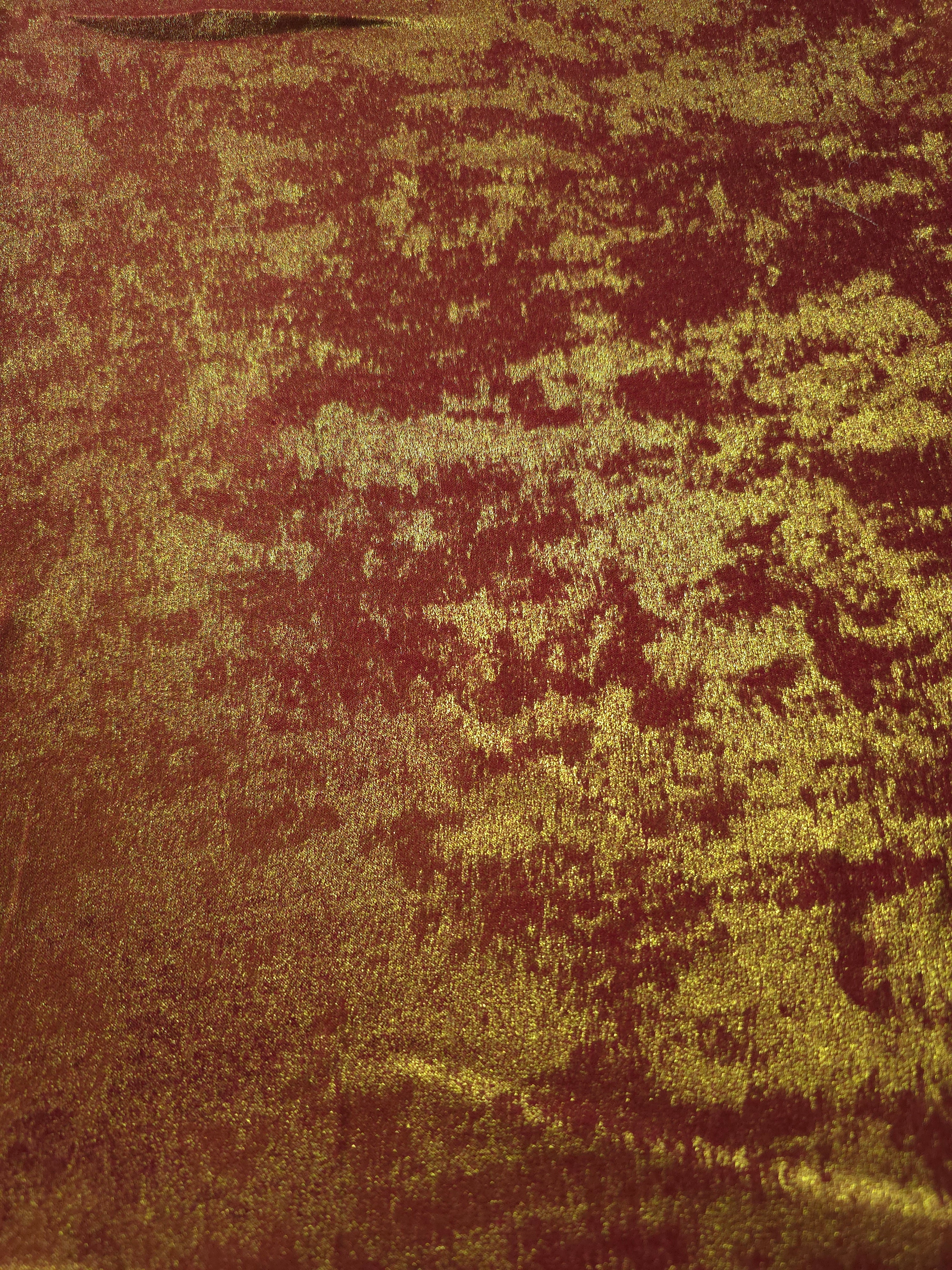 Flat view of Burgundy Gold Lurex Italiano fabric showing its metallic foil surface for luxury apparel.