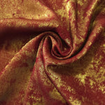 Rosette drape of Burgundy Gold Lurex Italiano fabric emphasizing shimmer for kaftans and occasionwear.