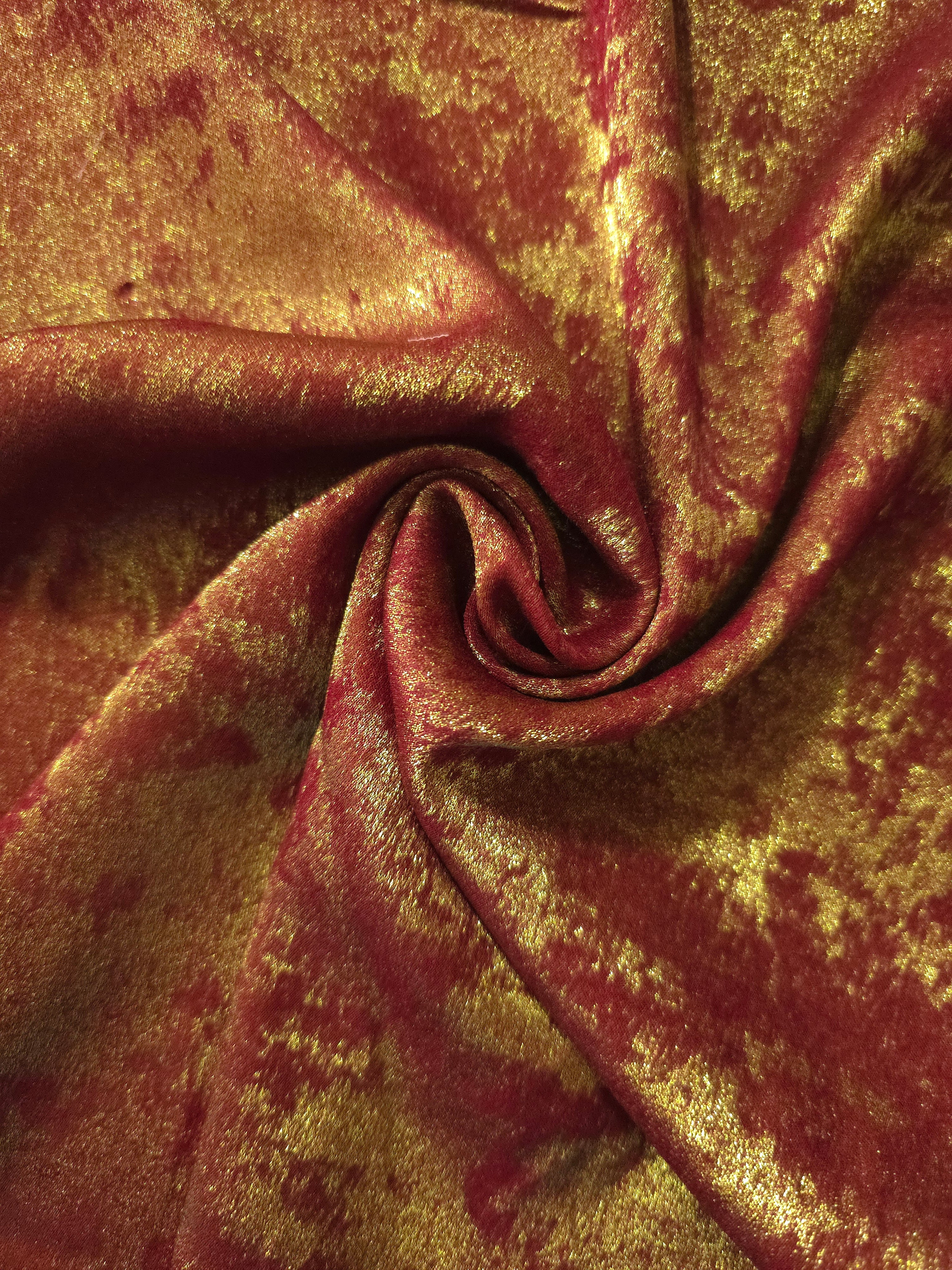 Rosette drape of Burgundy Gold Lurex Italiano fabric emphasizing shimmer for kaftans and occasionwear.