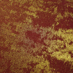 Macro close-up of Burgundy Gold Lurex Italiano fabric revealing metallic texture for designer apparel.