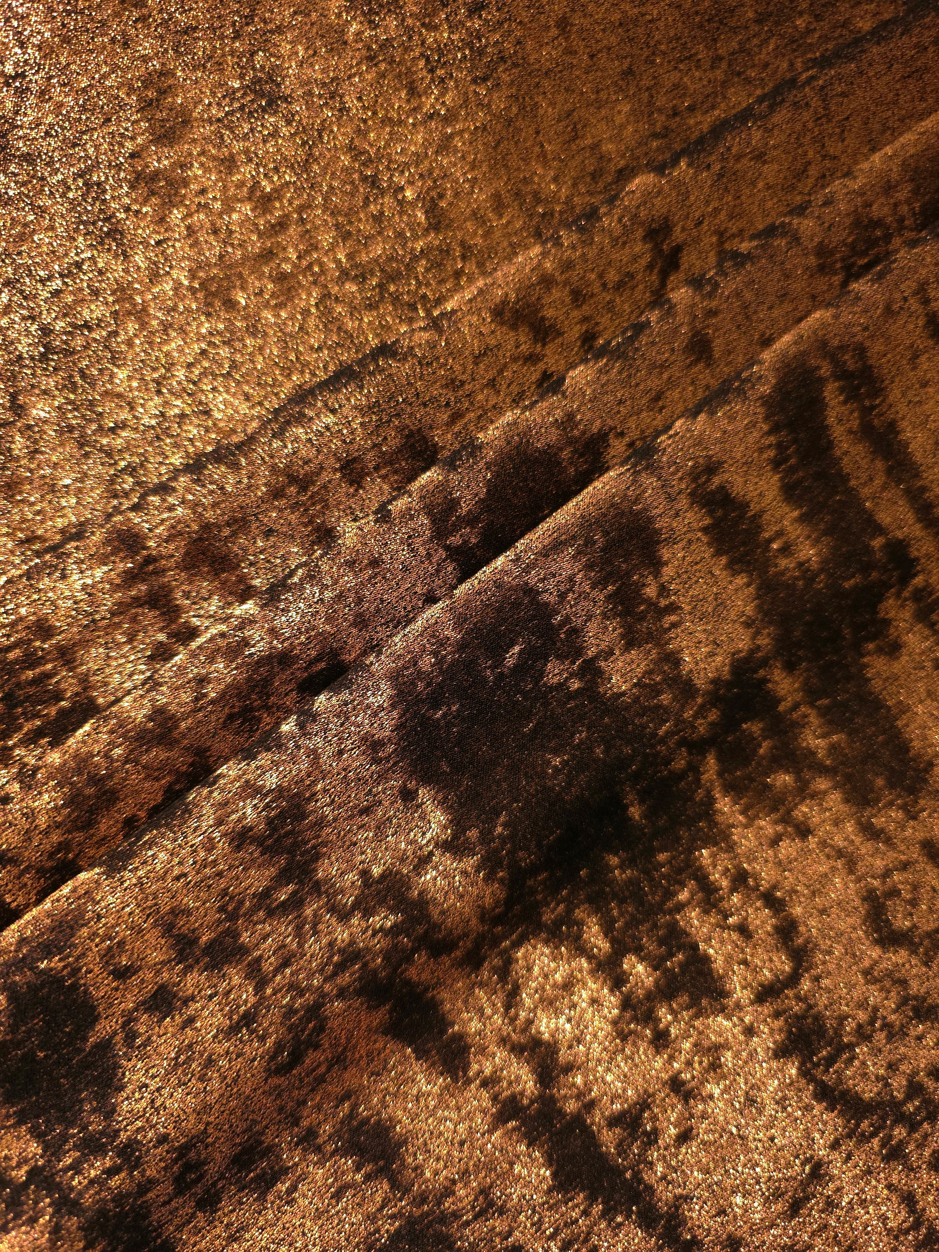 Burnished Copper Lurex Italiano metallic fabric in diagonal folds for eveningwear