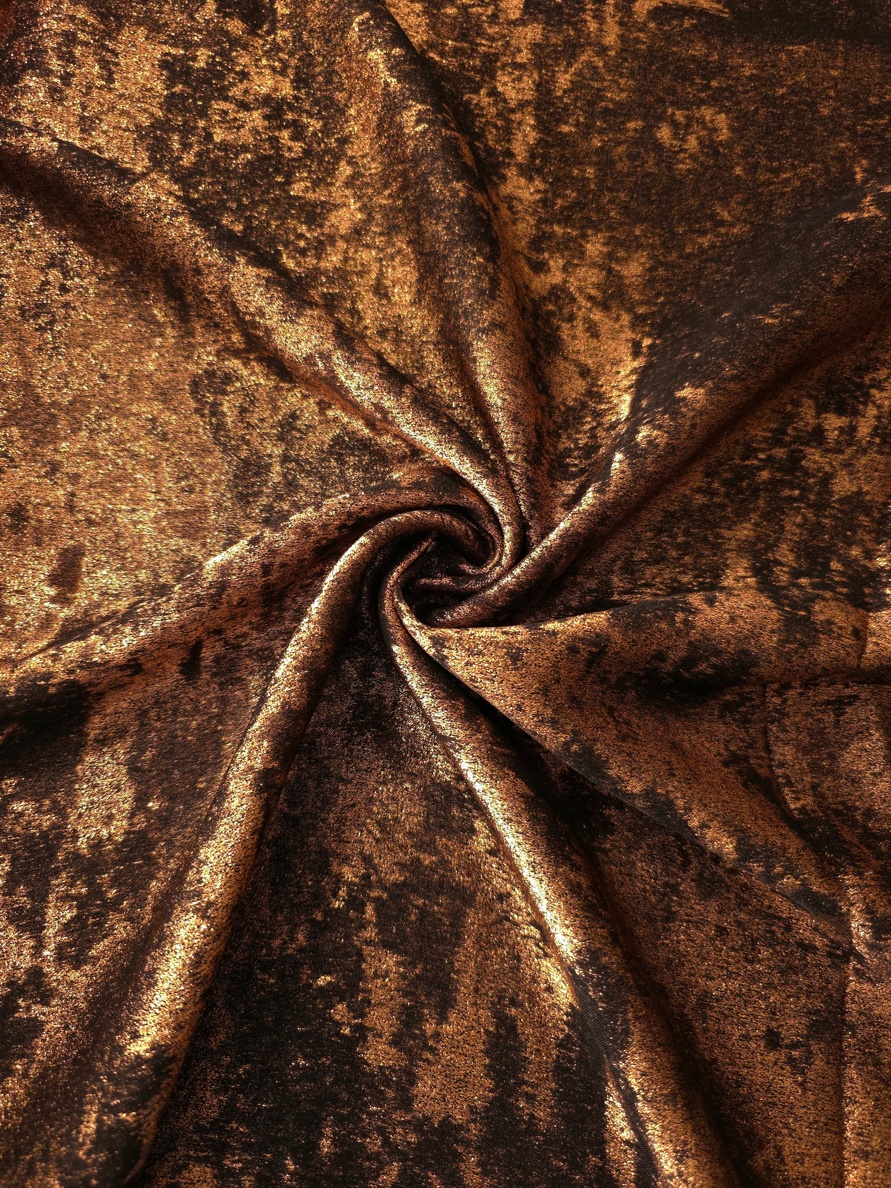 Burnished Copper Lurex Italiano metallic fabric in a shimmering rosette drape