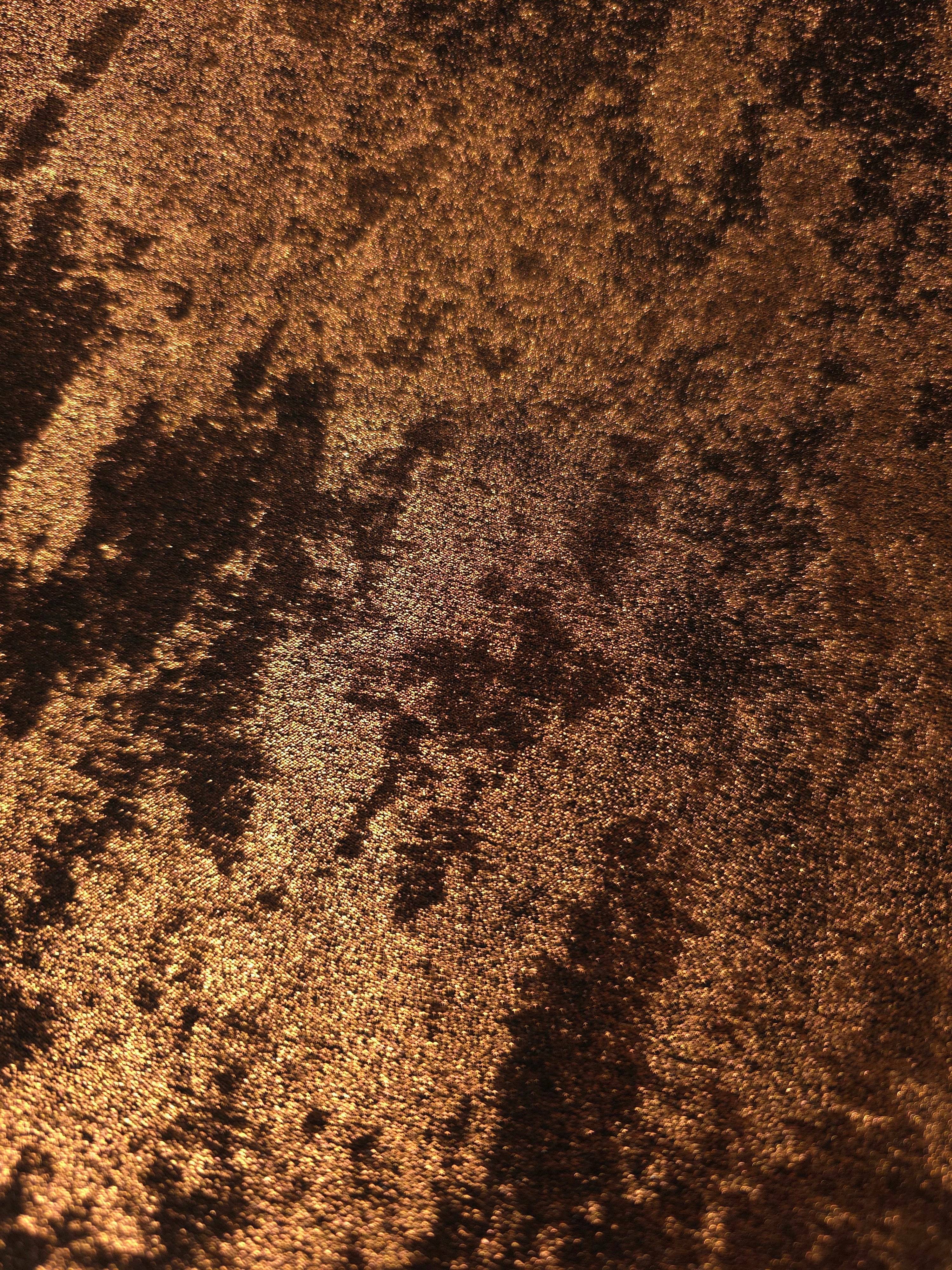 Macro detail of Burnished Copper Lurex Italiano metallic fabric with pearl shimmer