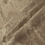 Champagne Beige Lurex Italiano fabric in diagonal folds showing metallic sheen and drape for eveningwear.