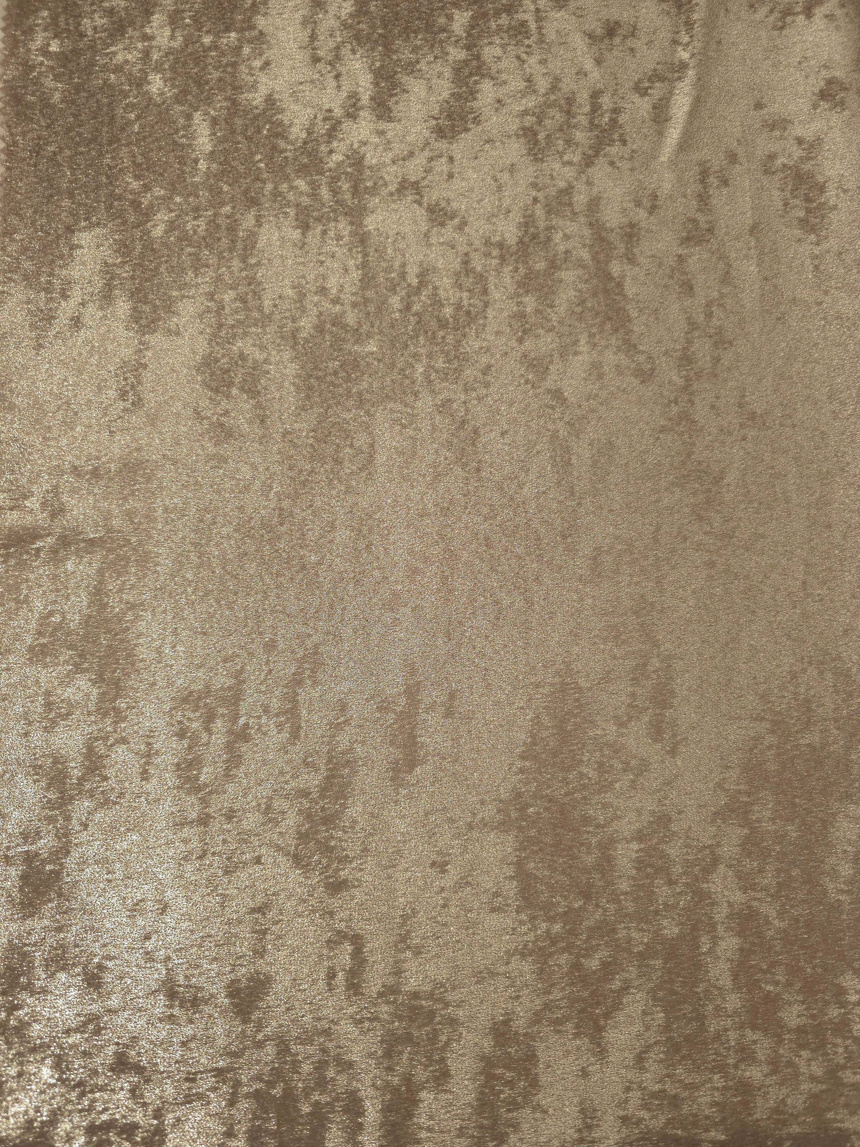 Flat view of Champagne Beige Lurex Italiano fabric showing its metallic foil surface for luxury apparel.