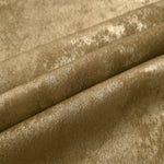Champagne Gold Lurex Italiano fabric in diagonal folds showing metallic sheen and drape for eveningwear.