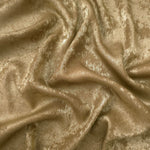 Flowing folds of Champagne Gold Lurex Italiano fabric highlighting drape for abayas, kaftans and dresses.