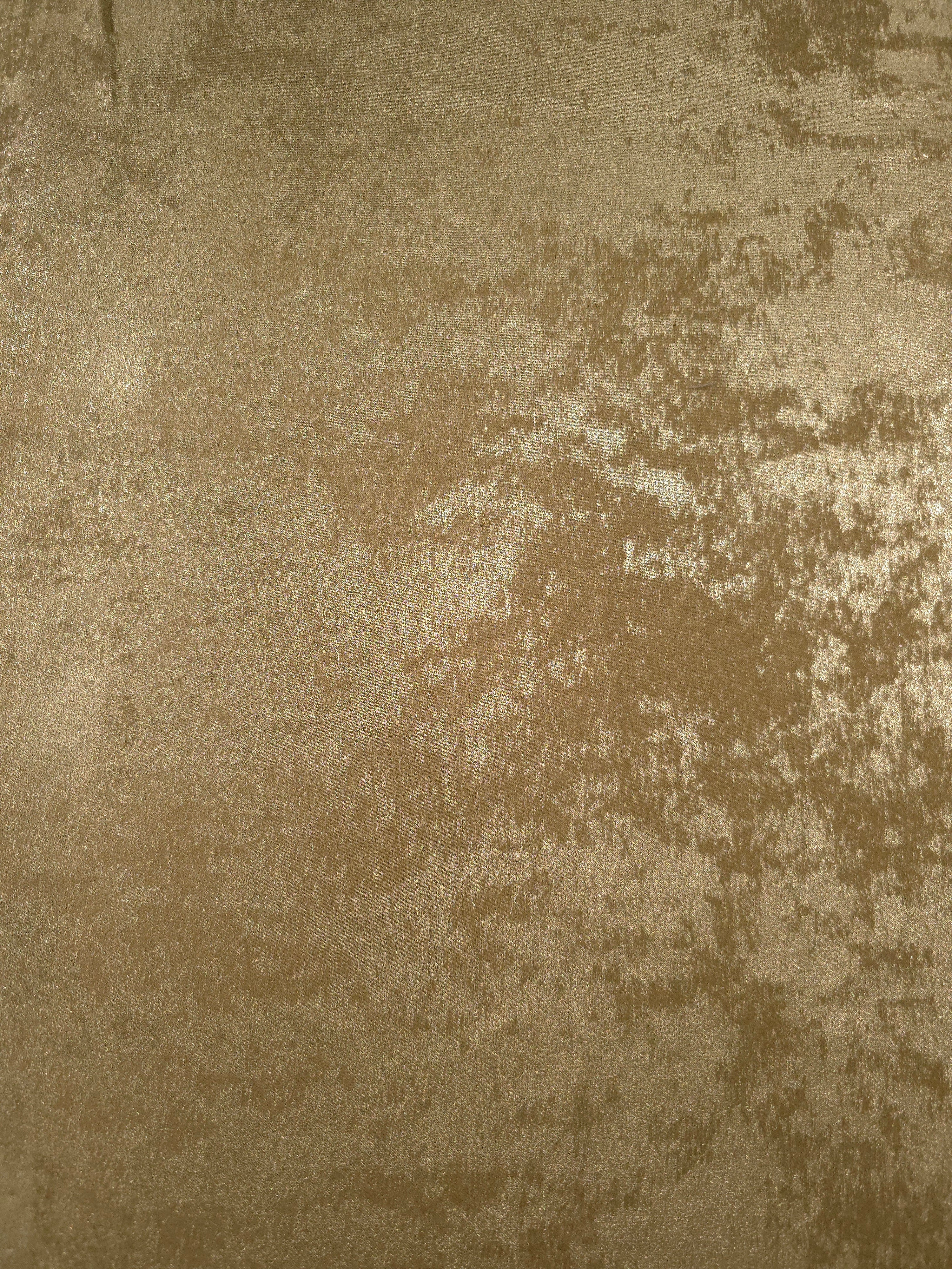 Flat view of Champagne Gold Lurex Italiano fabric showing its metallic foil surface for luxury apparel.