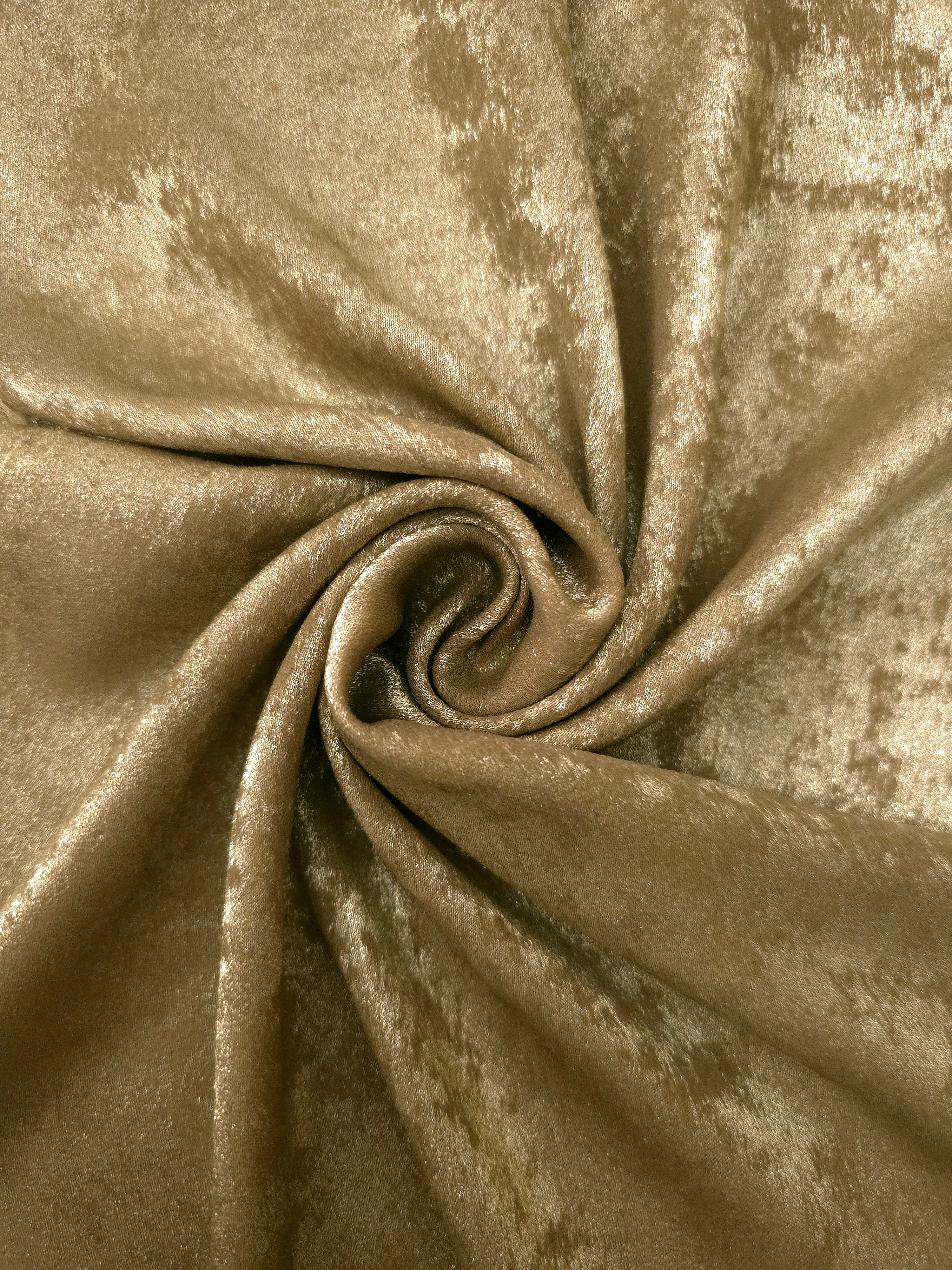 Rosette drape of Champagne Gold Lurex Italiano fabric emphasizing shimmer for kaftans and occasionwear.