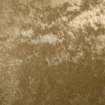 Macro close-up of Champagne Gold Lurex Italiano fabric revealing metallic texture for designer apparel.