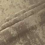 Champagne Taupe Lurex Italiano fabric in diagonal folds showing metallic sheen and drape for eveningwear.