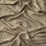 Flowing folds of Champagne Taupe Lurex Italiano fabric highlighting drape for abayas, kaftans and dresses.
