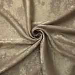 Rosette drape of Champagne Taupe Lurex Italiano fabric emphasizing shimmer for kaftans and occasionwear.
