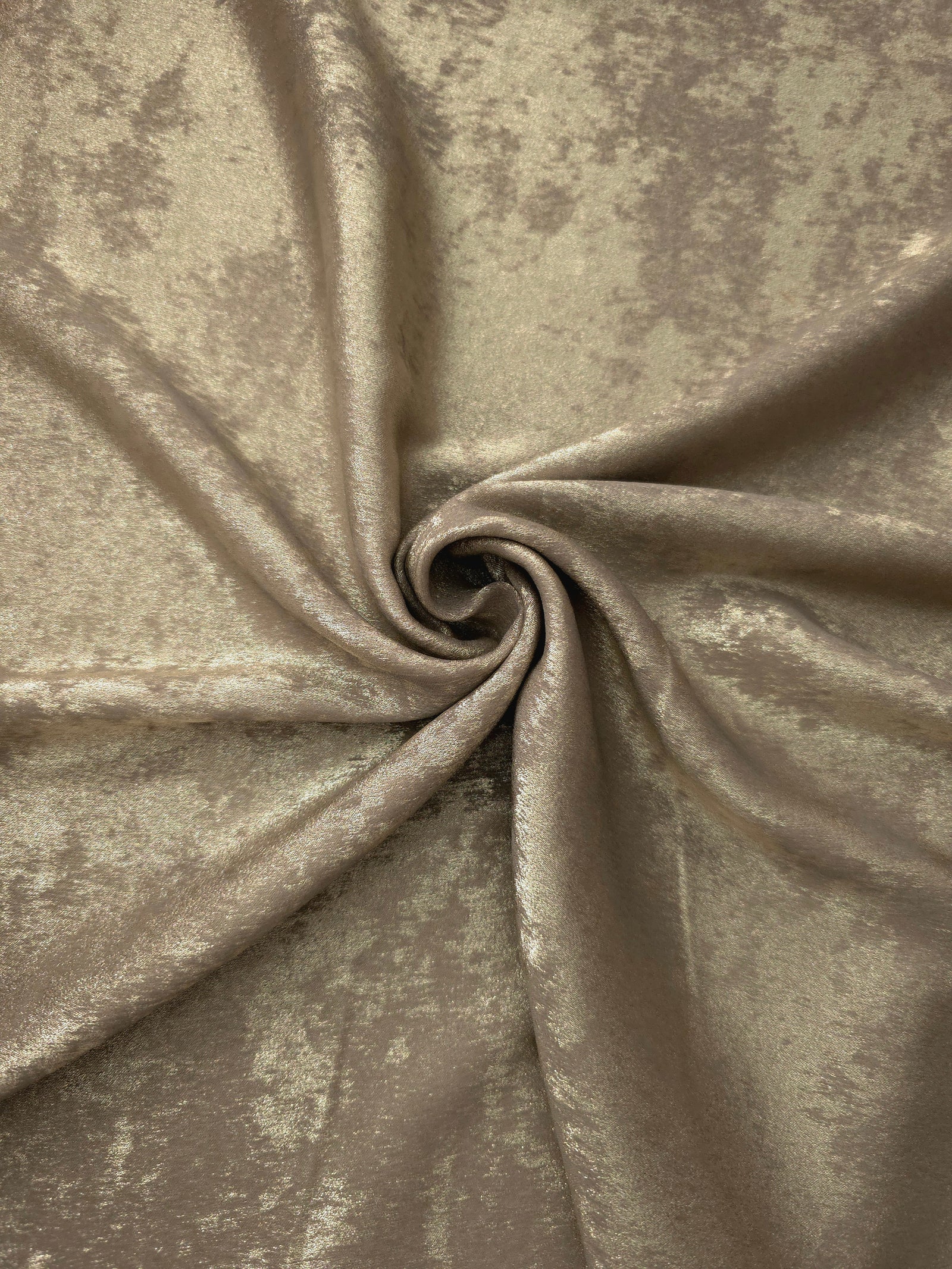 Rosette drape of Champagne Taupe Lurex Italiano fabric emphasizing shimmer for kaftans and occasionwear.