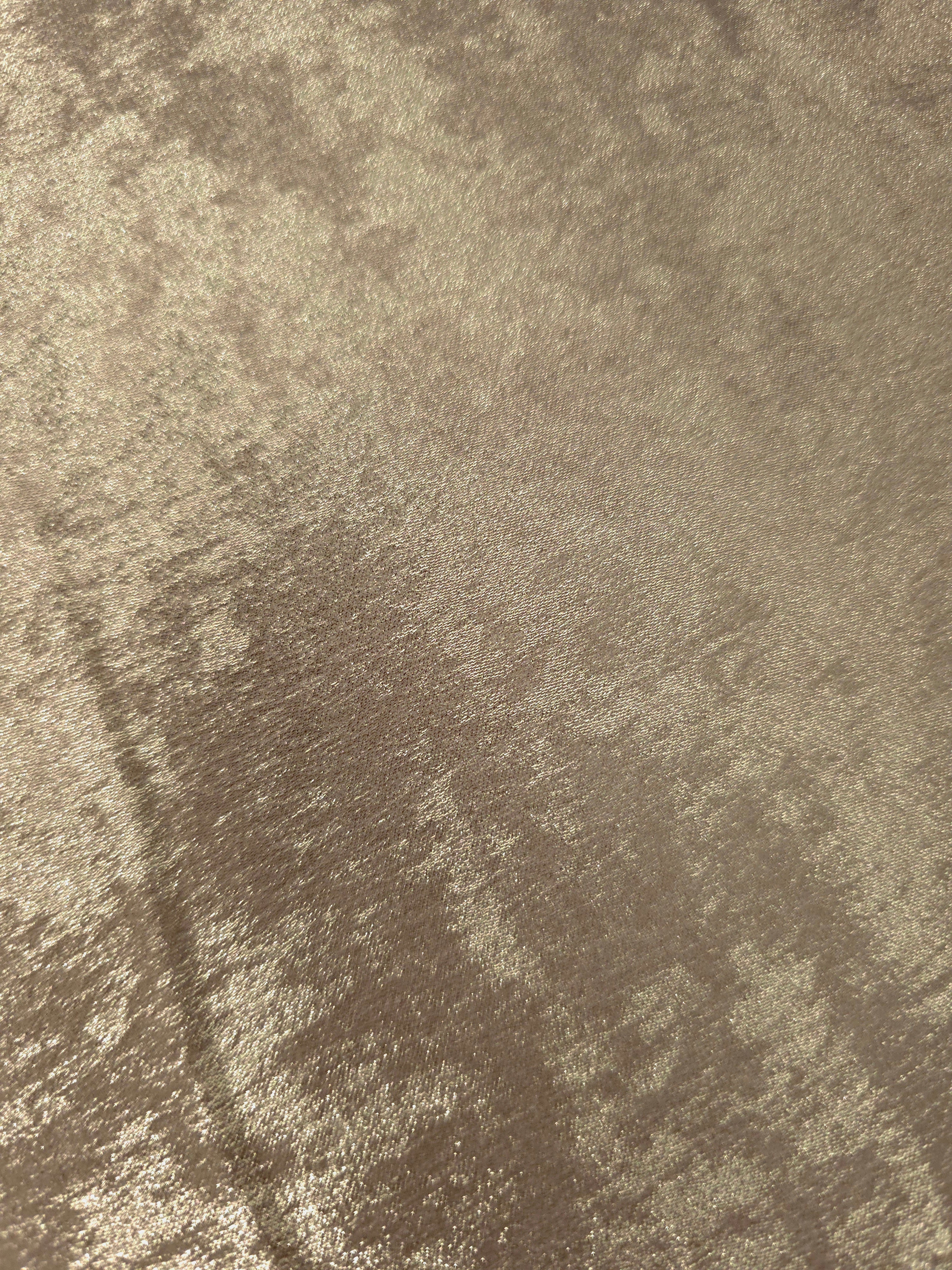 Macro close-up of Champagne Taupe Lurex Italiano fabric revealing metallic texture for designer apparel.