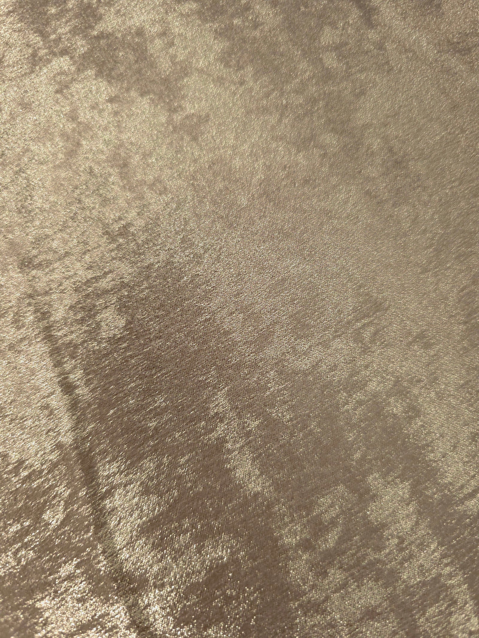 Macro close-up of Champagne Taupe Lurex Italiano fabric revealing metallic texture for designer apparel.