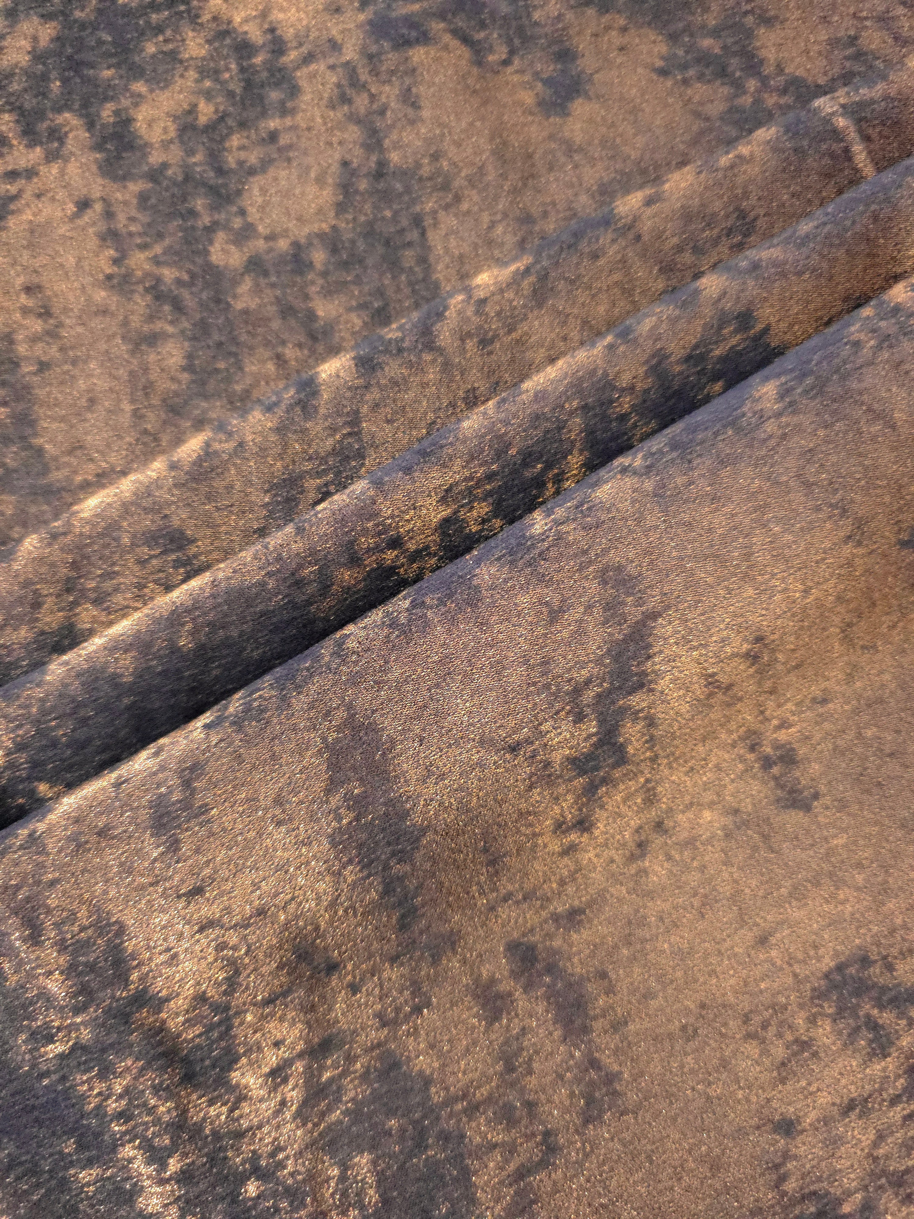 Cocoa Bronze Lurex Italiano fabric in diagonal folds showing metallic sheen and drape for eveningwear.