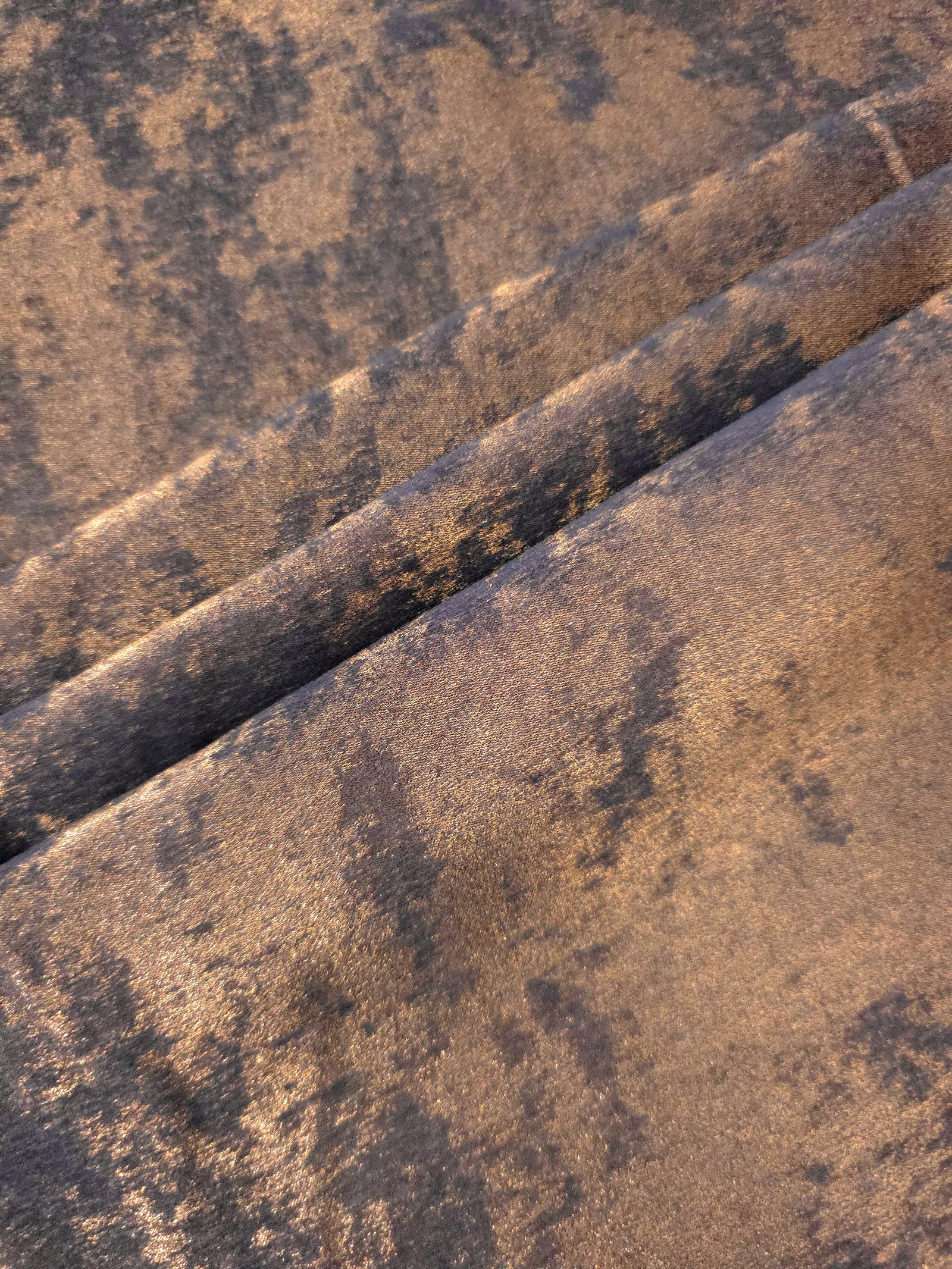 Cocoa Bronze Lurex Italiano fabric in diagonal folds showing metallic sheen and drape for eveningwear.