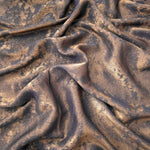 Flowing folds of Cocoa Bronze Lurex Italiano fabric highlighting drape for abayas, kaftans and dresses.