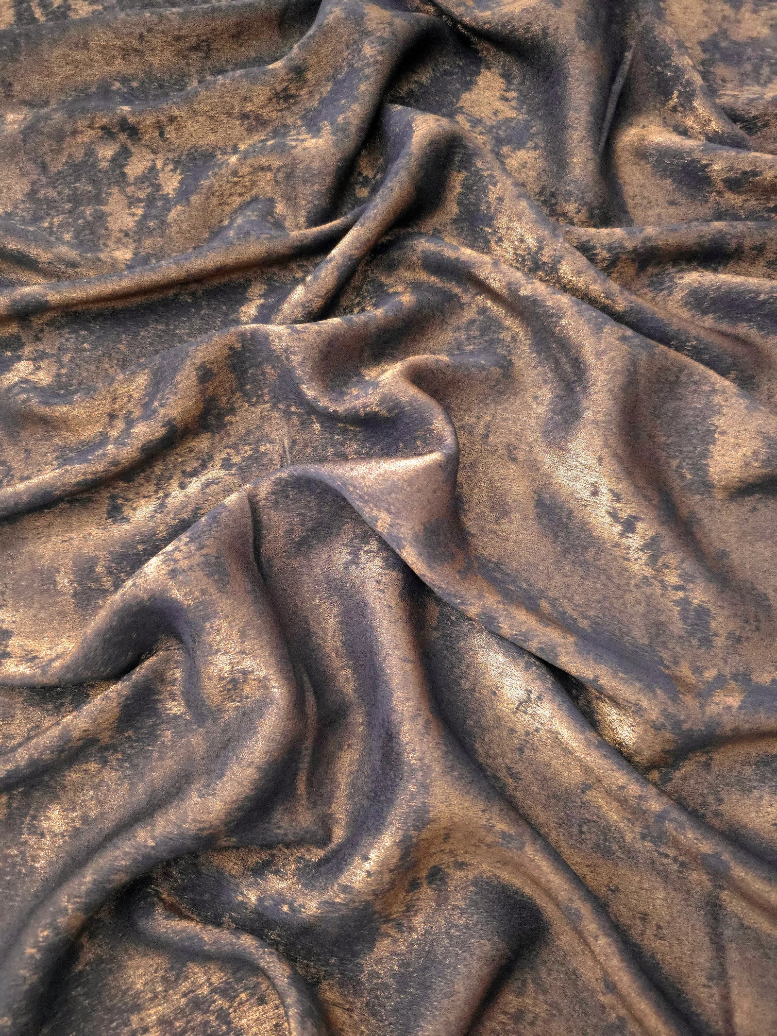 Flowing folds of Cocoa Bronze Lurex Italiano fabric highlighting drape for abayas, kaftans and dresses.