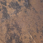 Macro close-up of Cocoa Bronze Lurex Italiano fabric revealing metallic texture for designer apparel.
