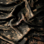 Flowing folds of Copper Black Lurex Italiano fabric highlighting drape for abayas, kaftans and dresses.