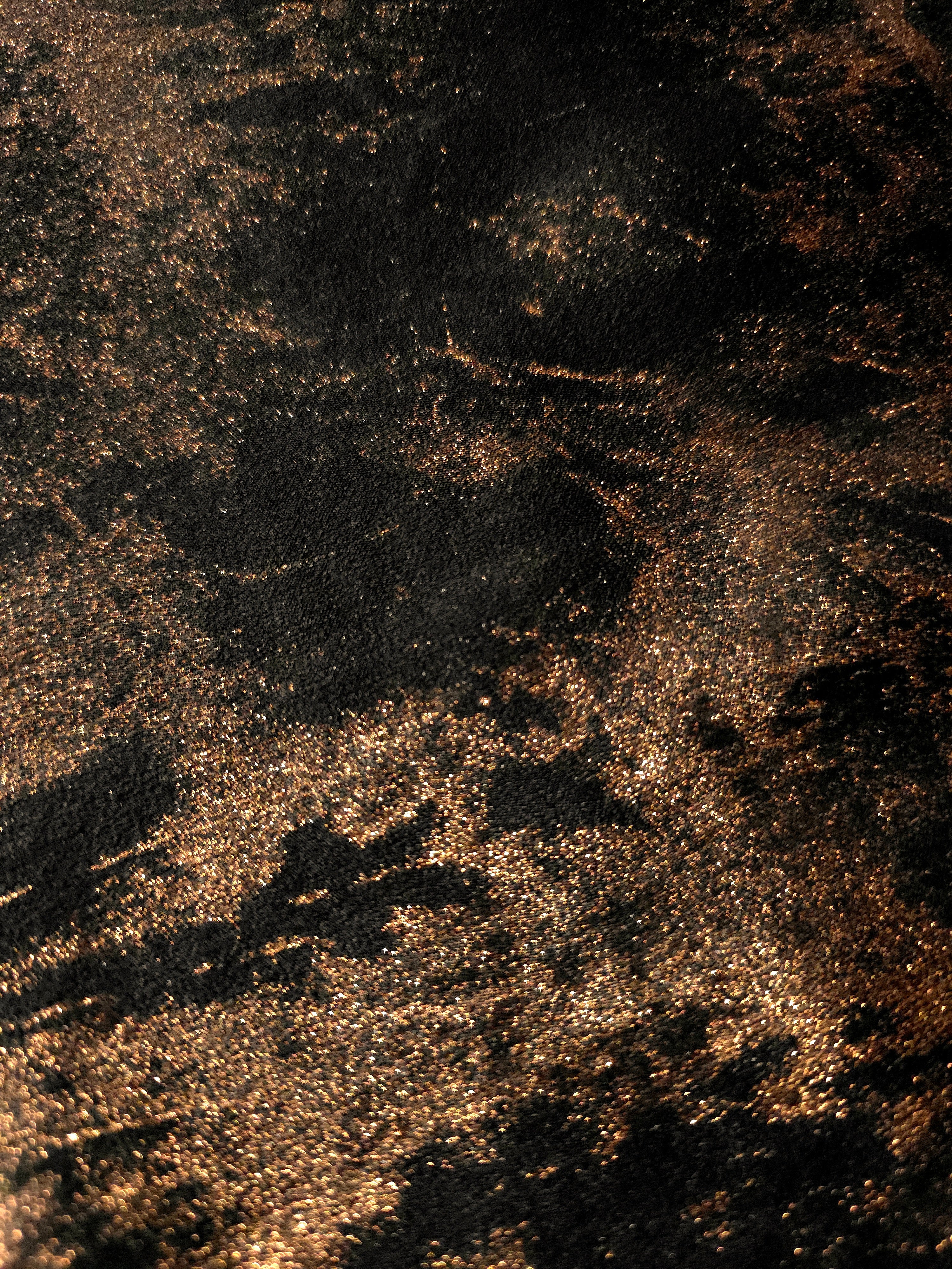Macro close-up of Copper Black Lurex Italiano metallic fabric with pearlescent texture