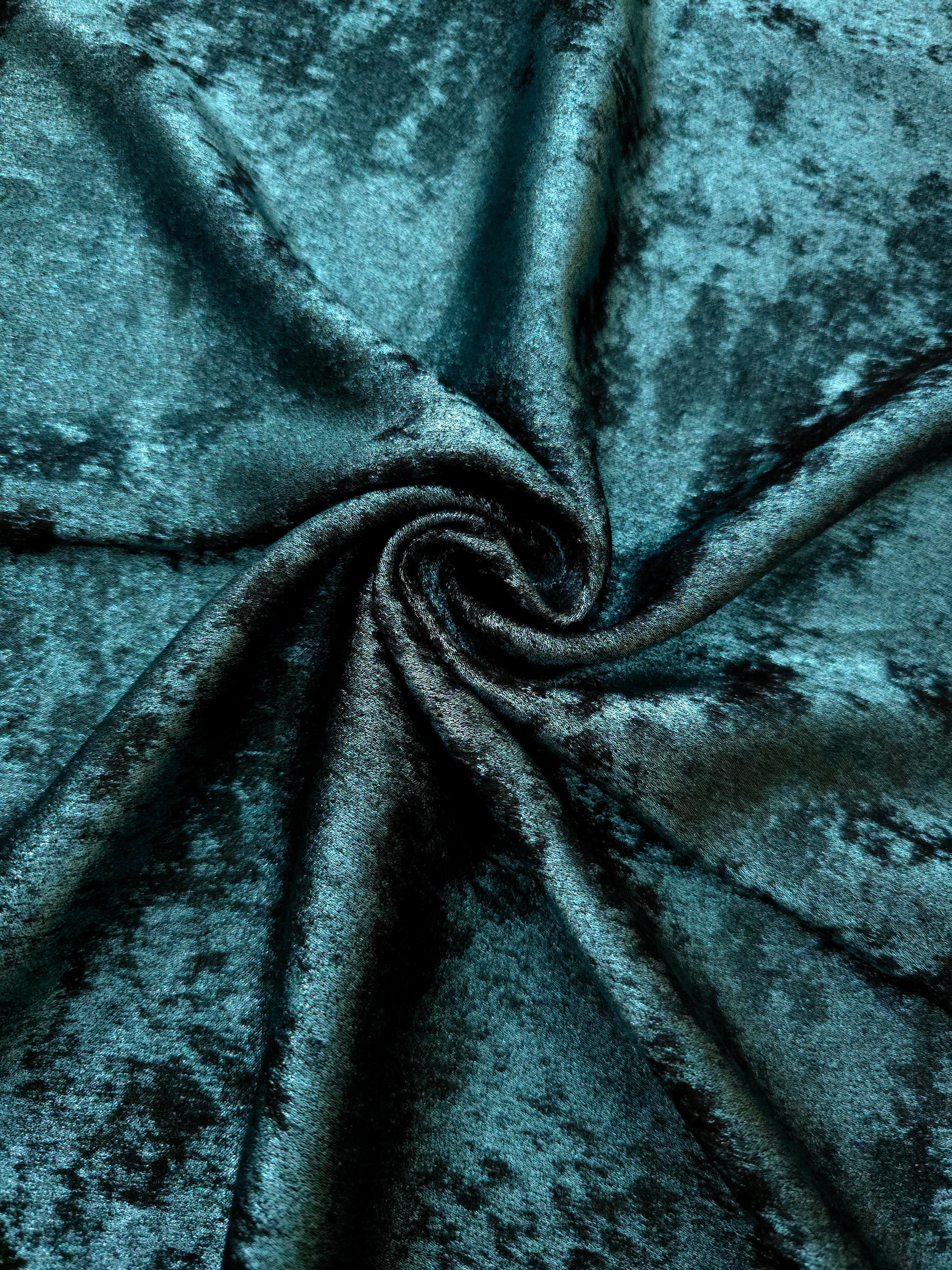 Deep Teal Lurex Italiano metallic fabric in a rosette drape with rich shimmer