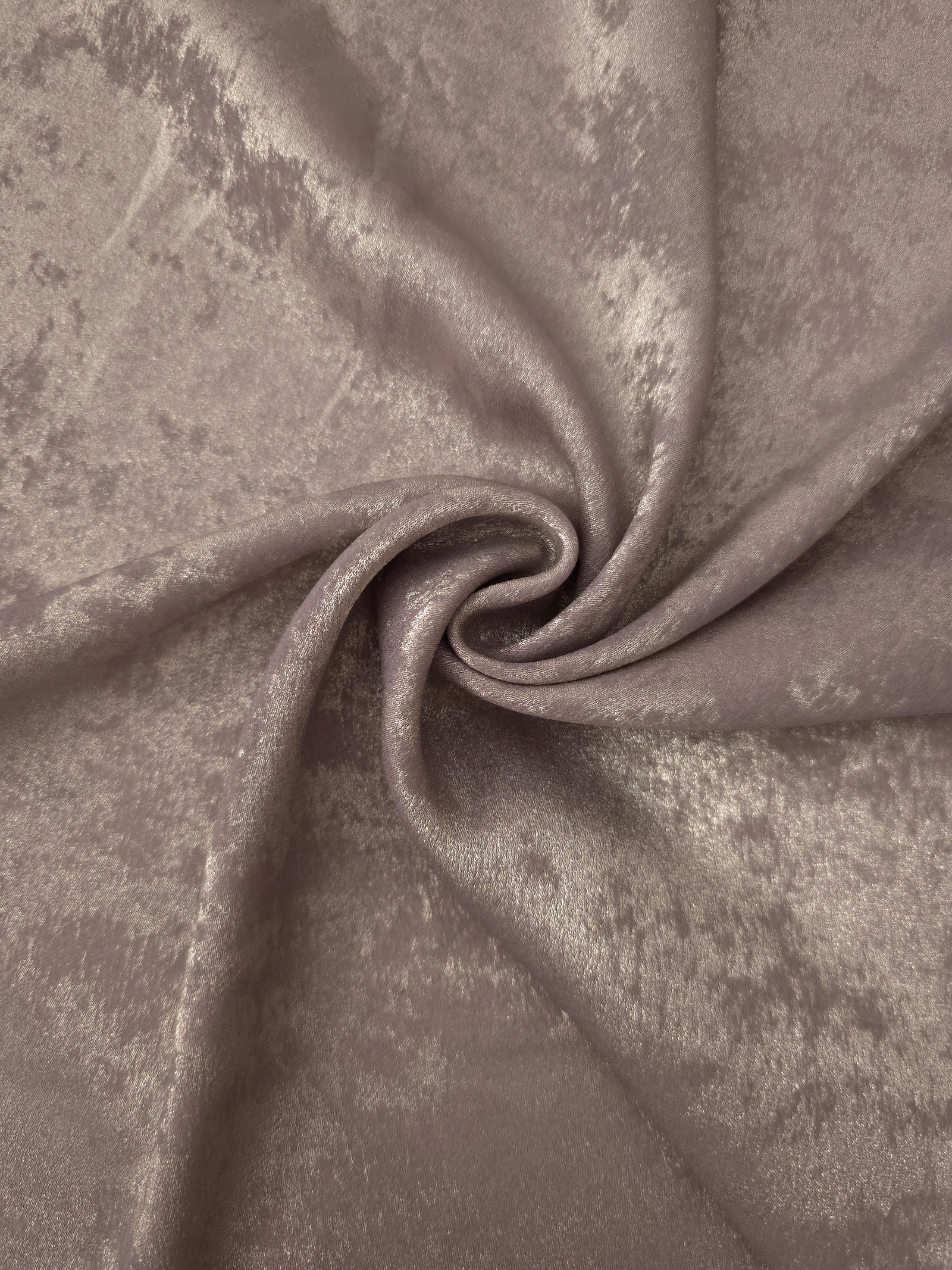 Flowing folds of Dusty Mauve Lurex Italiano fabric highlighting drape for abayas, kaftans and dresses.