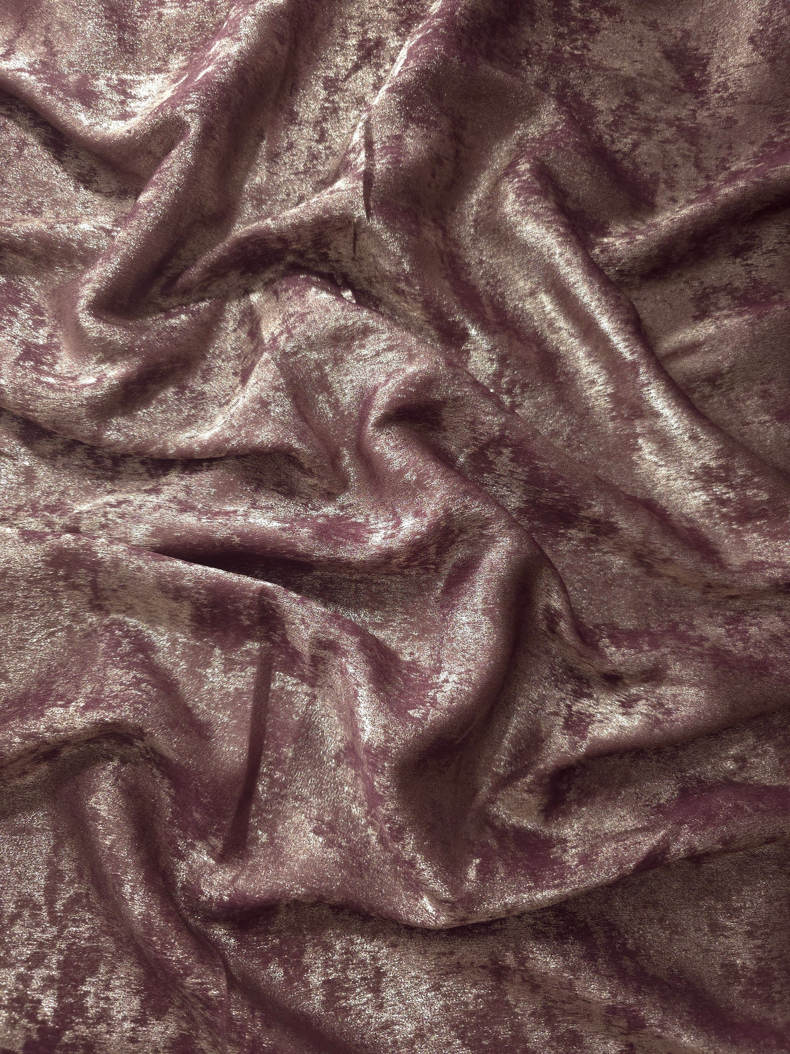 Flowing folds of Dusty Plum Lurex Italiano fabric highlighting drape for abayas, kaftans and dresses.