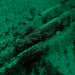 Emerald Green Lurex Italiano fabric in diagonal folds showing metallic sheen and drape for eveningwear.