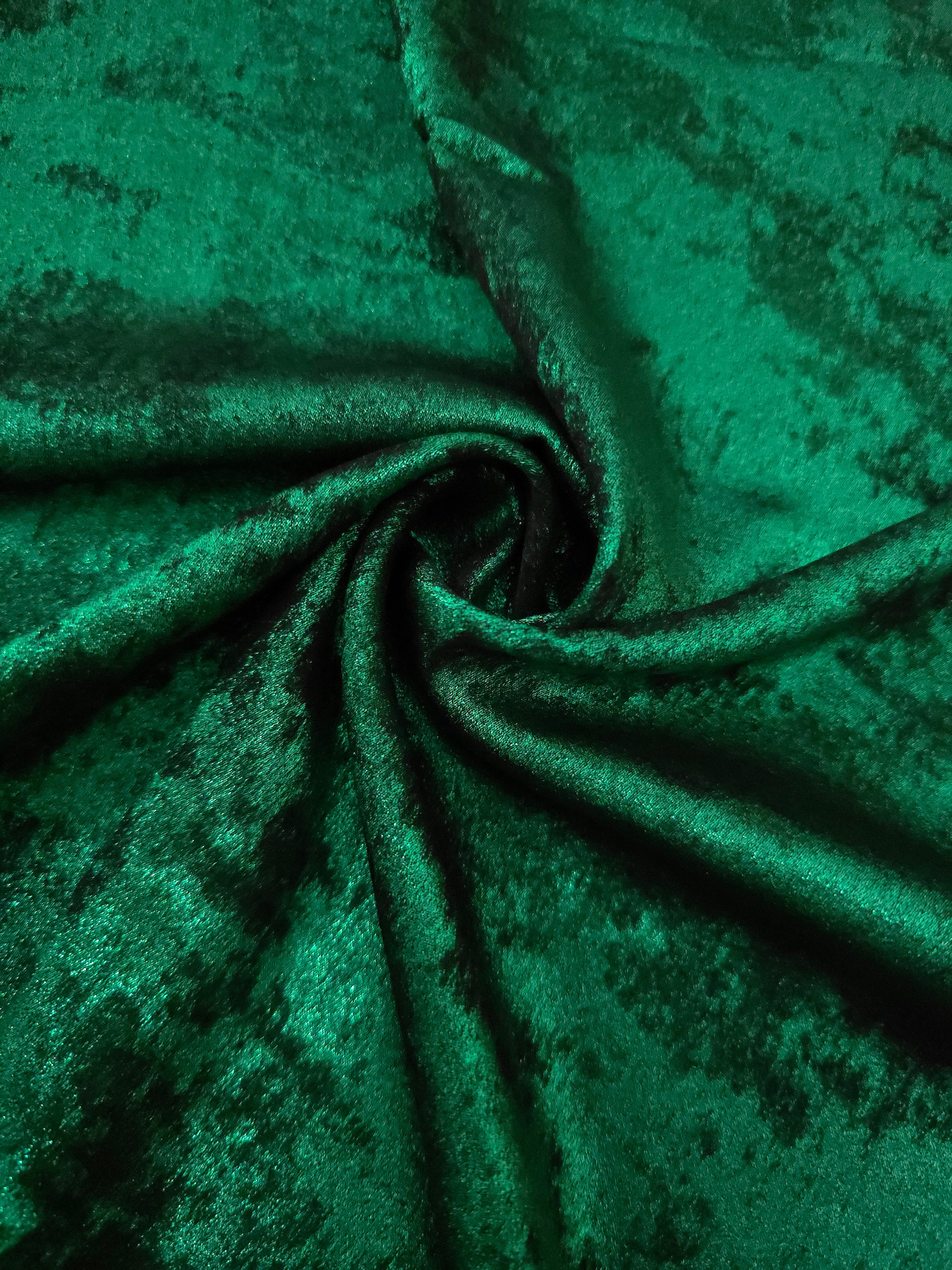 Rosette drape of Emerald Green Lurex Italiano fabric emphasizing shimmer for kaftans and occasionwear.