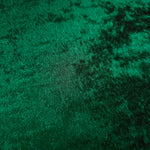 Macro close-up of Emerald Green Lurex Italiano fabric revealing metallic texture for designer apparel.