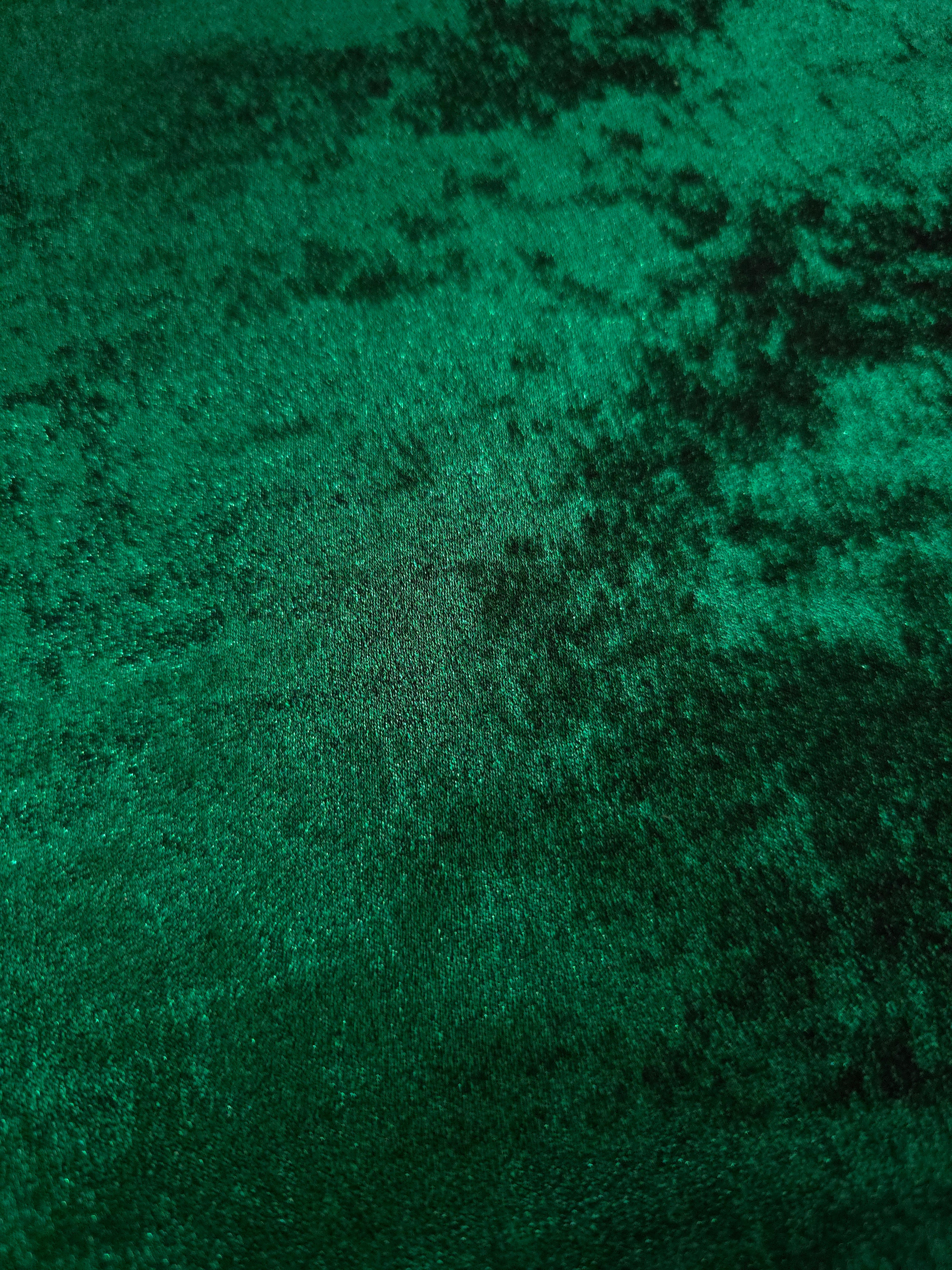 Macro close-up of Emerald Green Lurex Italiano fabric revealing metallic texture for designer apparel.
