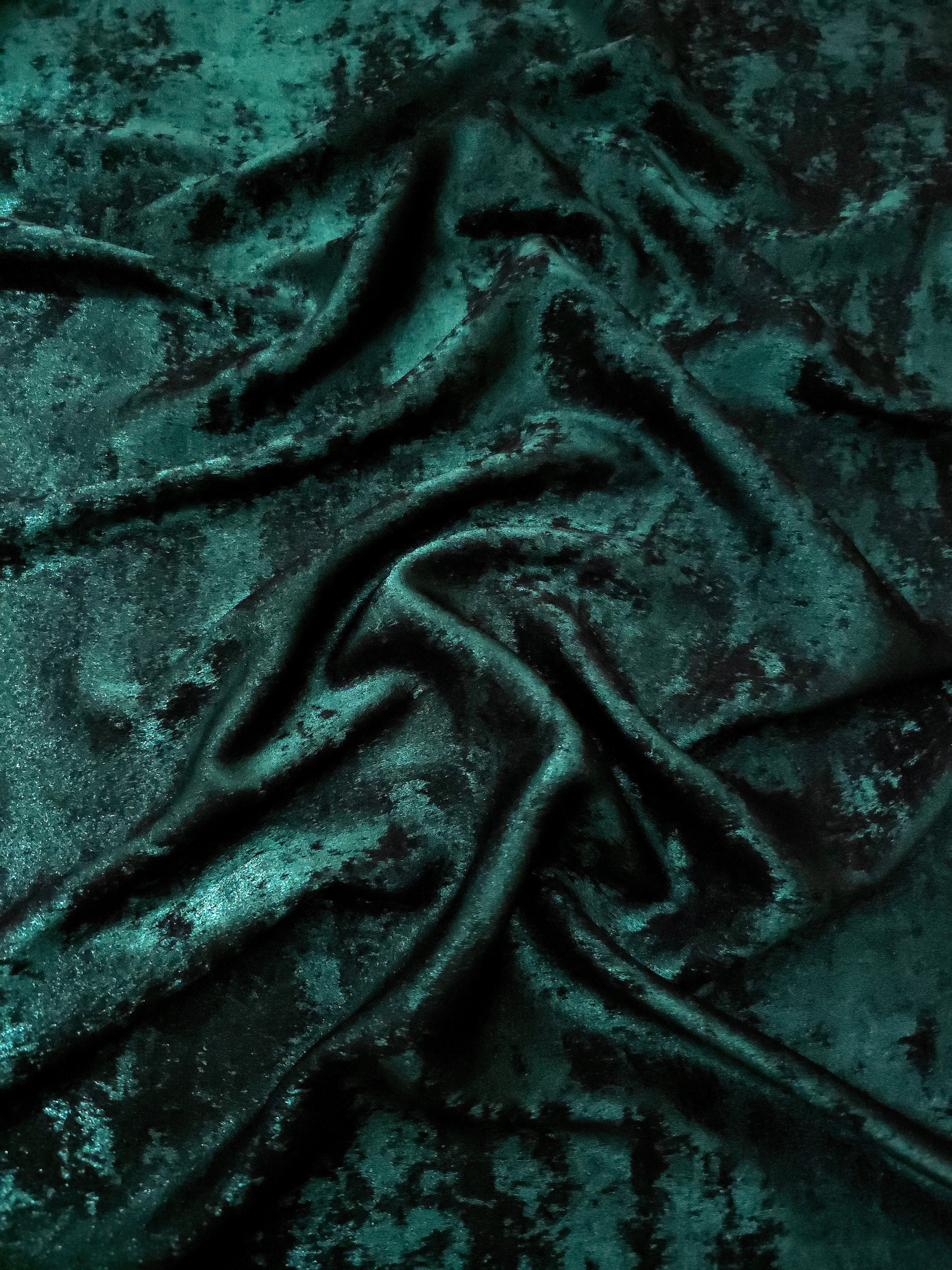 Emerald Teal Lurex Italiano metallic fabric in a rosette drape with jewel-tone shimmer