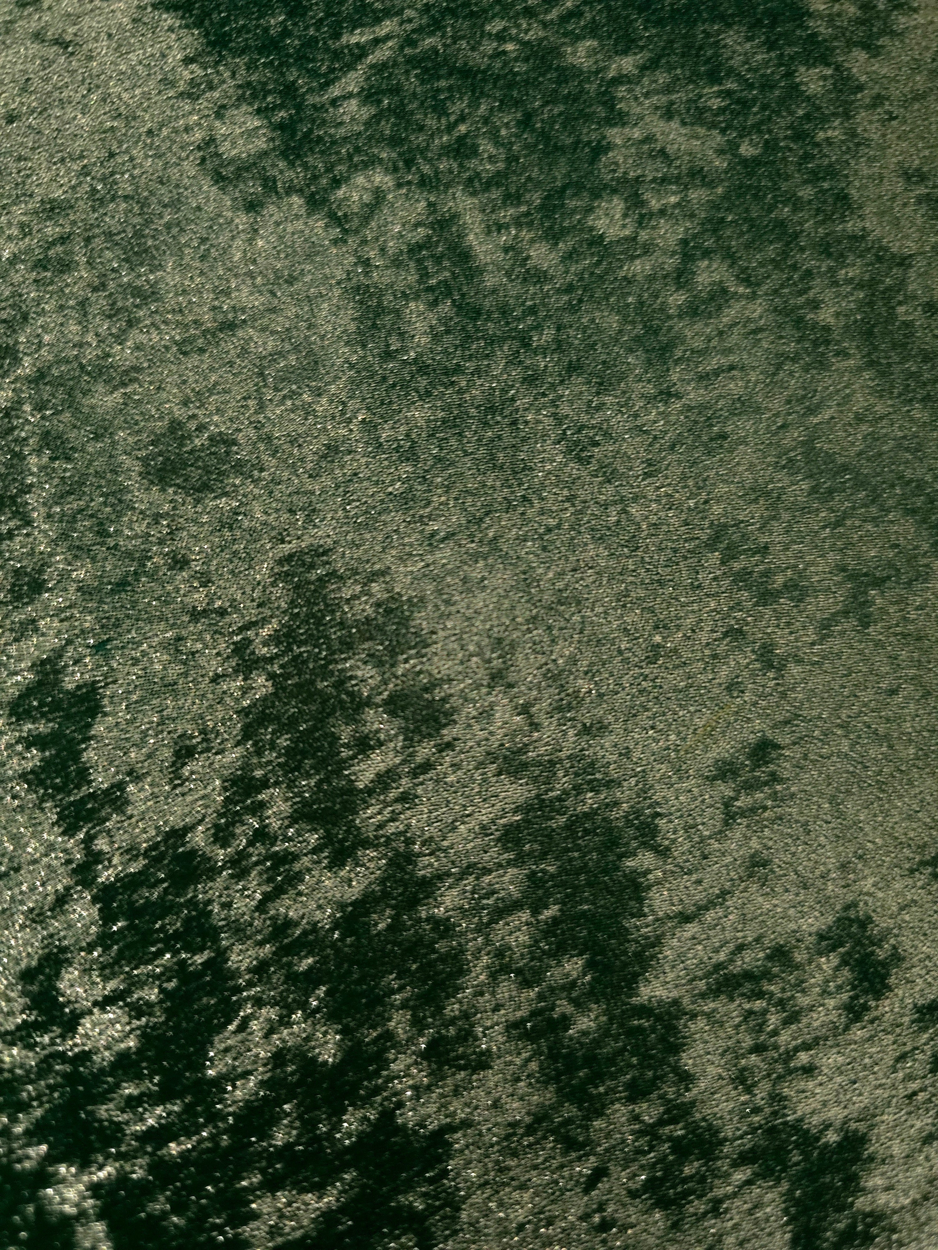 Macro close-up of Forest Green Lurex Italiano metallic fabric pearlescent texture