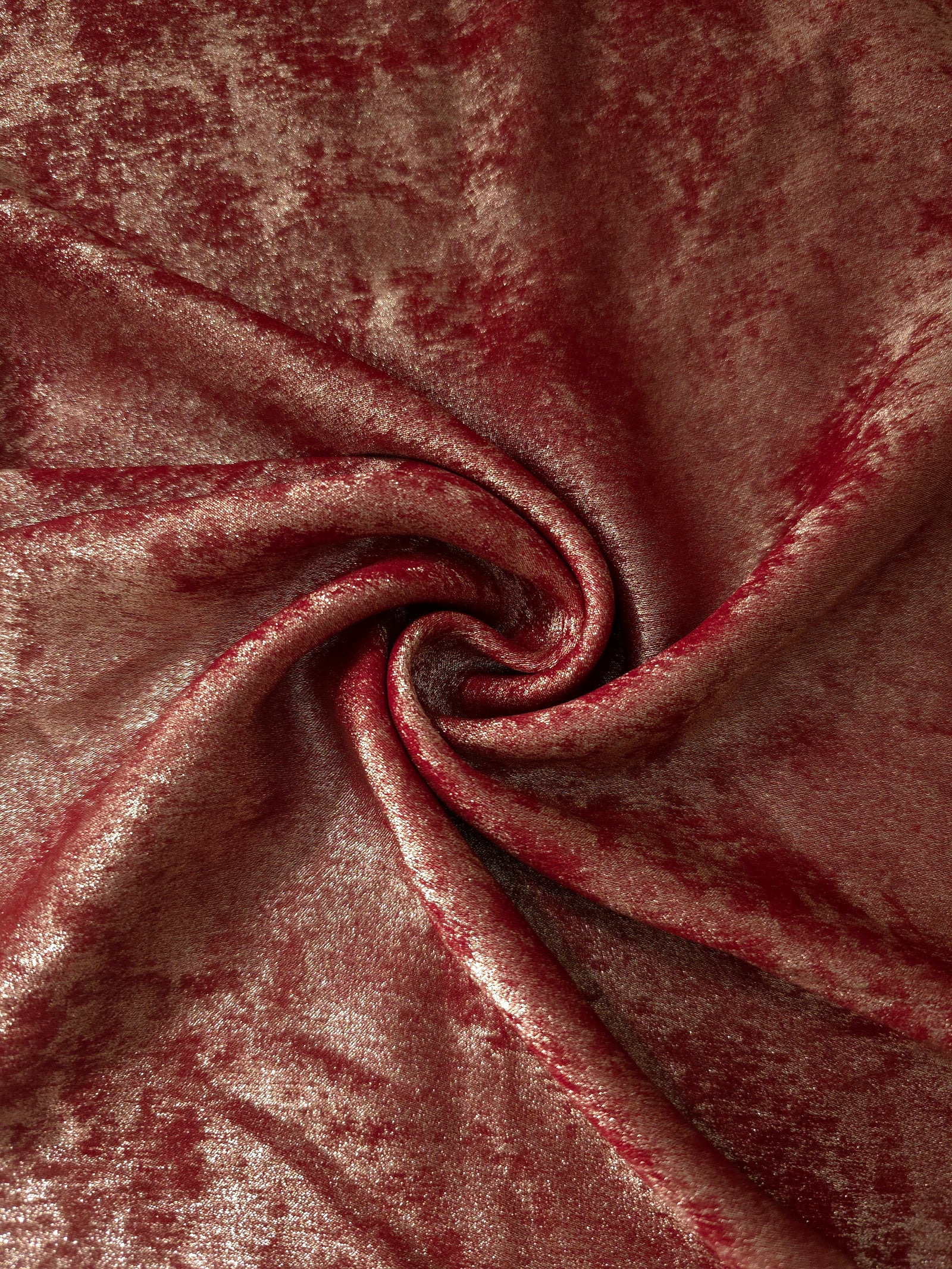 Rosette drape of Garnet Rose Lurex Italiano fabric emphasizing shimmer for kaftans and occasionwear.