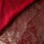 Reverse side of Garnet Rose Lurex Italiano fabric showing the backing and metallic finish for garment production.