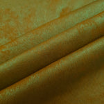 Golden Olive Lurex Italiano fabric in diagonal folds showing metallic sheen and drape for eveningwear.