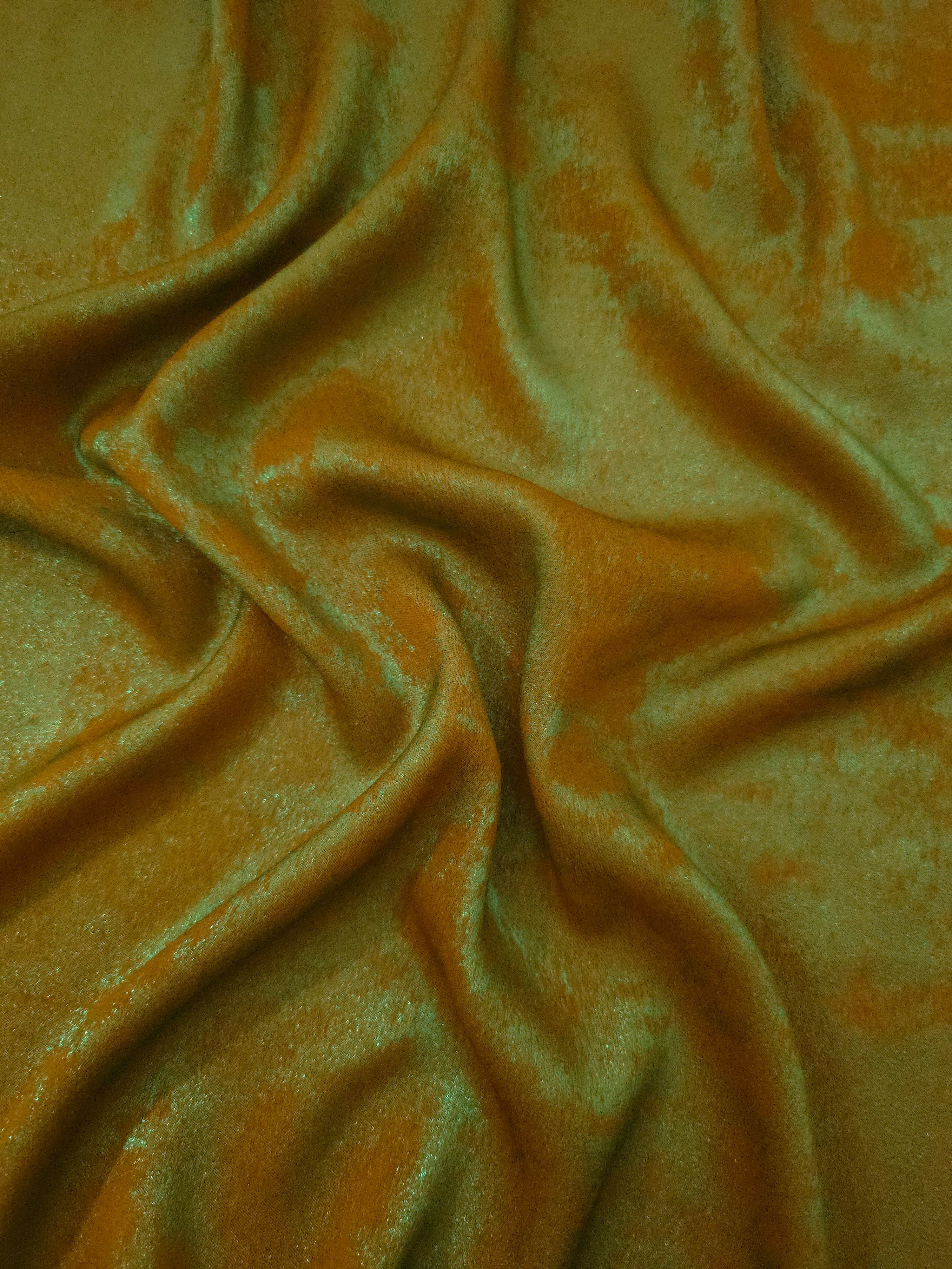 Flowing folds of Golden Olive Lurex Italiano fabric highlighting drape for abayas, kaftans and dresses.