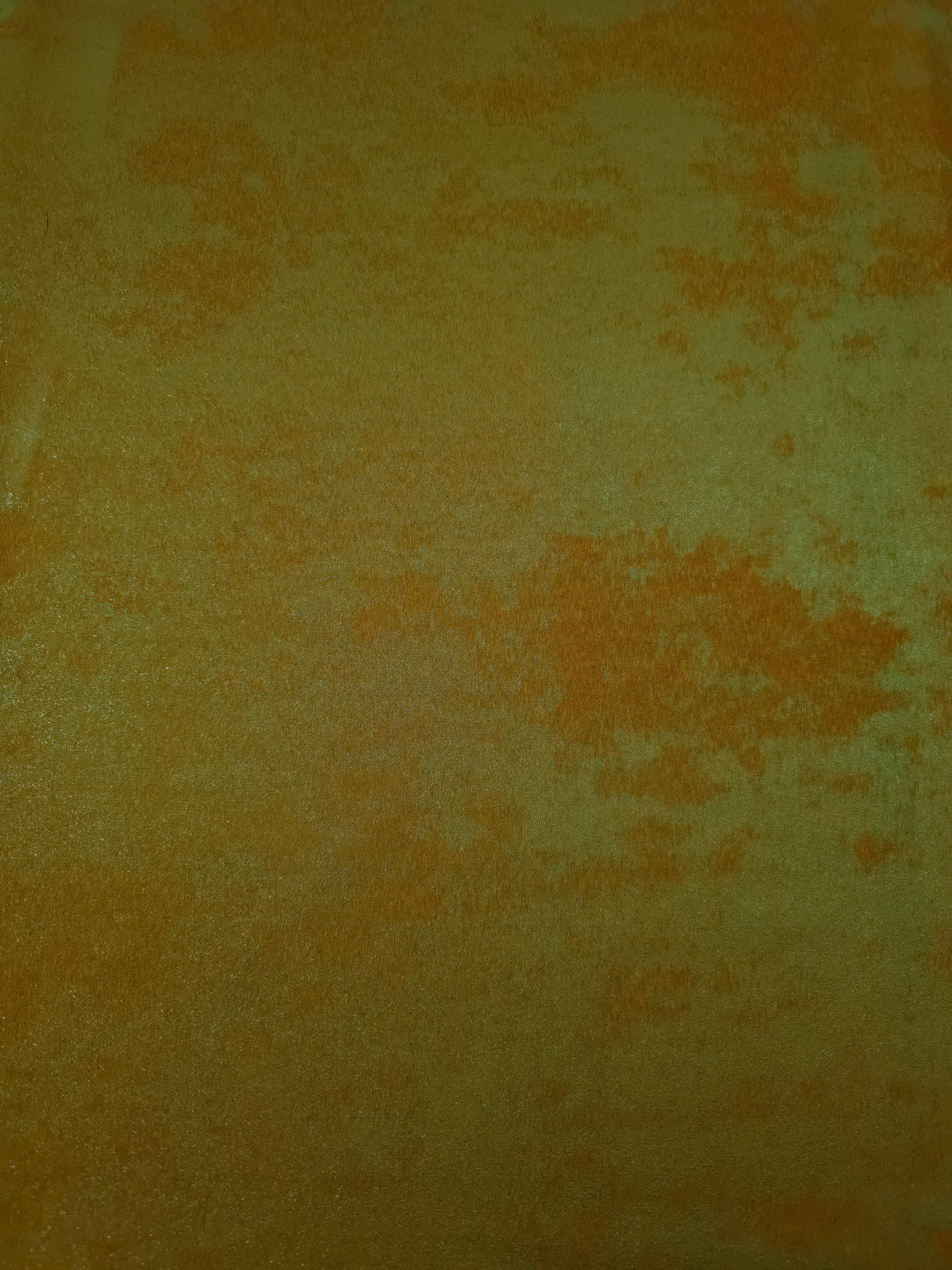 Flat view of Golden Olive Lurex Italiano fabric showing its metallic foil surface for luxury apparel.